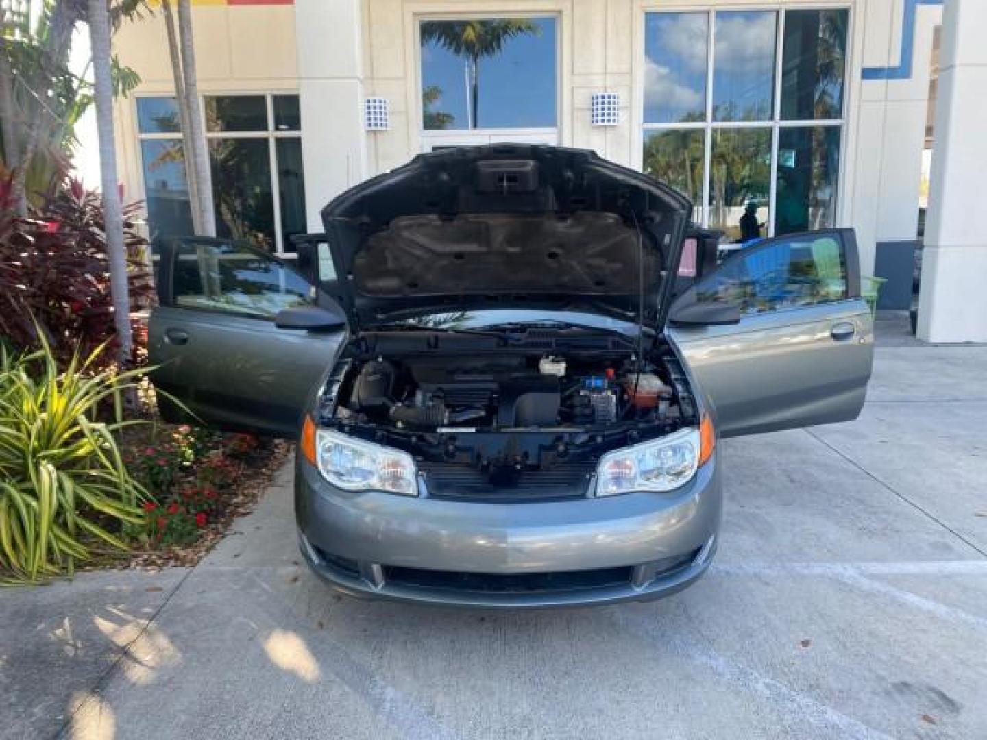 2007 Storm Gray /Black Saturn Ion 3 DR COUPE 1 OWNER FL LO MI 35,356 (1G8AN15F37Z) with an 2.2L DOHC MFI 16-Valve I4 Ecotec Engine engine, Automatic transmission, located at 4701 North Dixie Hwy, Pompano Beach, FL, 33064, (954) 422-2889, 26.240938, -80.123474 - OUR WEBPAGE FLORIDACARS1.COM HAS OVER 100 PHOTOS AND FREE CARFAX LINK VIN: 1G8AN15F37Z152136 1 G 8 A N 1 5 F 3 7 Z 1 5 2 1 3 6 COUPE 4 DR 2.2L I4 F GASOLINE 32 MPG FRONT WHEEL DRIVE Highlighted Features AM/FM Stereo Auxiliary Audio Input Power Locks Rear Defroster Air Conditioning CD Audio Power Mir - Photo#16