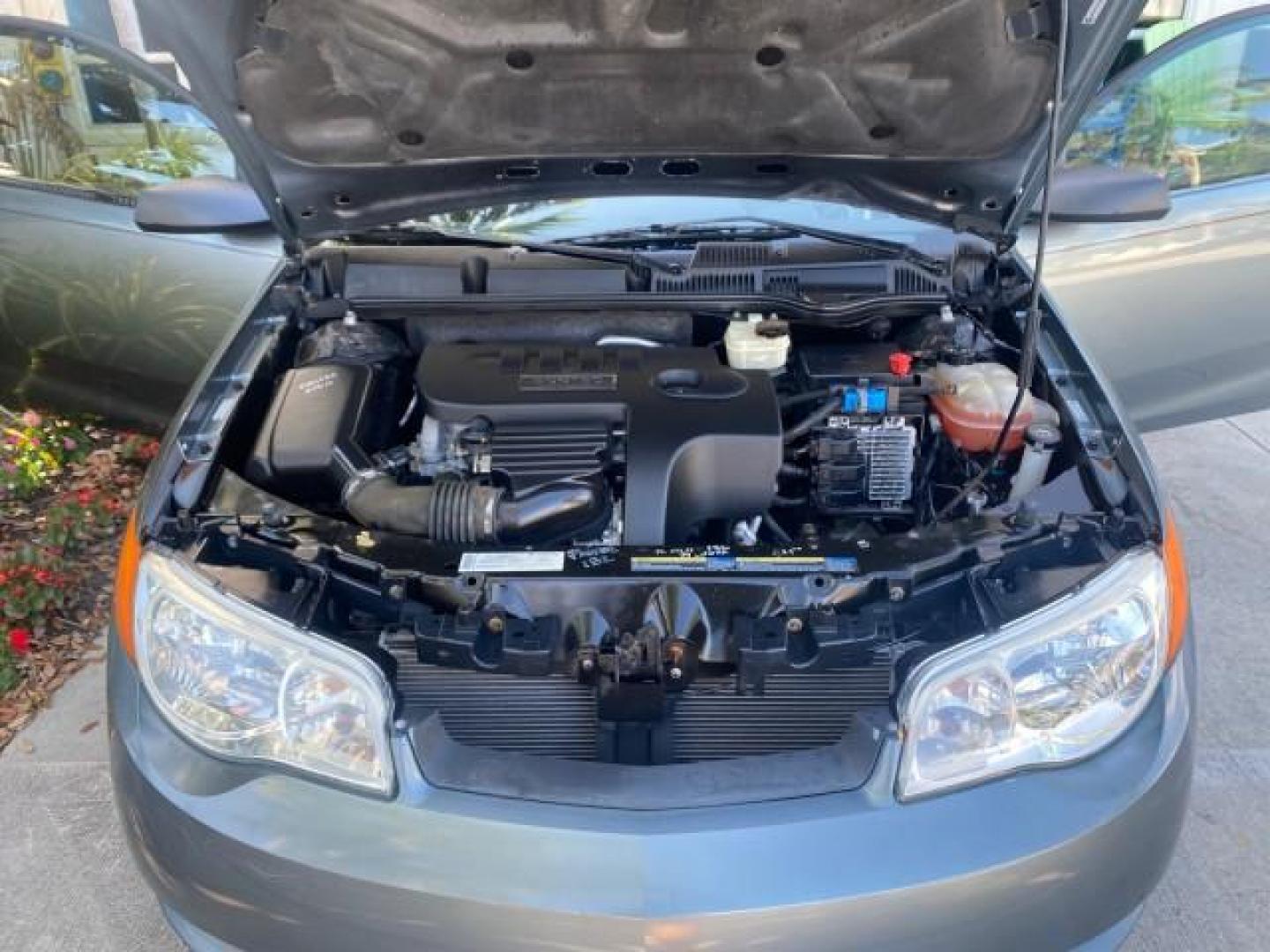 2007 Storm Gray /Black Saturn Ion 3 DR COUPE 1 OWNER FL LO MI 35,356 (1G8AN15F37Z) with an 2.2L DOHC MFI 16-Valve I4 Ecotec Engine engine, Automatic transmission, located at 4701 North Dixie Hwy, Pompano Beach, FL, 33064, (954) 422-2889, 26.240938, -80.123474 - OUR WEBPAGE FLORIDACARS1.COM HAS OVER 100 PHOTOS AND FREE CARFAX LINK VIN: 1G8AN15F37Z152136 1 G 8 A N 1 5 F 3 7 Z 1 5 2 1 3 6 COUPE 4 DR 2.2L I4 F GASOLINE 32 MPG FRONT WHEEL DRIVE Highlighted Features AM/FM Stereo Auxiliary Audio Input Power Locks Rear Defroster Air Conditioning CD Audio Power Mir - Photo#17