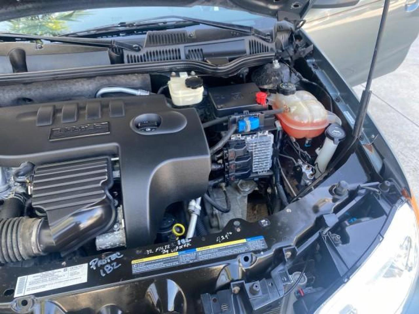 2007 Storm Gray /Black Saturn Ion 3 DR COUPE 1 OWNER FL LO MI 35,356 (1G8AN15F37Z) with an 2.2L DOHC MFI 16-Valve I4 Ecotec Engine engine, Automatic transmission, located at 4701 North Dixie Hwy, Pompano Beach, FL, 33064, (954) 422-2889, 26.240938, -80.123474 - OUR WEBPAGE FLORIDACARS1.COM HAS OVER 100 PHOTOS AND FREE CARFAX LINK VIN: 1G8AN15F37Z152136 1 G 8 A N 1 5 F 3 7 Z 1 5 2 1 3 6 COUPE 4 DR 2.2L I4 F GASOLINE 32 MPG FRONT WHEEL DRIVE Highlighted Features AM/FM Stereo Auxiliary Audio Input Power Locks Rear Defroster Air Conditioning CD Audio Power Mir - Photo#25