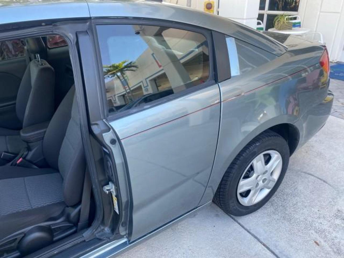 2007 Storm Gray /Black Saturn Ion 3 DR COUPE 1 OWNER FL LO MI 35,356 (1G8AN15F37Z) with an 2.2L DOHC MFI 16-Valve I4 Ecotec Engine engine, Automatic transmission, located at 4701 North Dixie Hwy, Pompano Beach, FL, 33064, (954) 422-2889, 26.240938, -80.123474 - OUR WEBPAGE FLORIDACARS1.COM HAS OVER 100 PHOTOS AND FREE CARFAX LINK VIN: 1G8AN15F37Z152136 1 G 8 A N 1 5 F 3 7 Z 1 5 2 1 3 6 COUPE 4 DR 2.2L I4 F GASOLINE 32 MPG FRONT WHEEL DRIVE Highlighted Features AM/FM Stereo Auxiliary Audio Input Power Locks Rear Defroster Air Conditioning CD Audio Power Mir - Photo#53