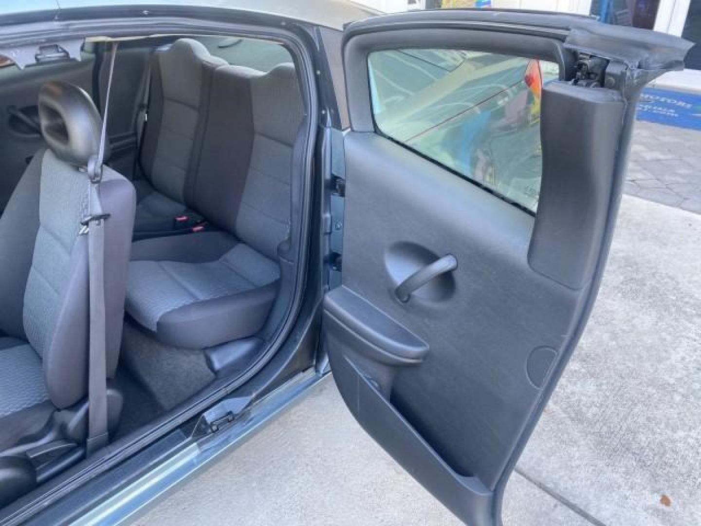 2007 Storm Gray /Black Saturn Ion 3 DR COUPE 1 OWNER FL LO MI 35,356 (1G8AN15F37Z) with an 2.2L DOHC MFI 16-Valve I4 Ecotec Engine engine, Automatic transmission, located at 4701 North Dixie Hwy, Pompano Beach, FL, 33064, (954) 422-2889, 26.240938, -80.123474 - OUR WEBPAGE FLORIDACARS1.COM HAS OVER 100 PHOTOS AND FREE CARFAX LINK VIN: 1G8AN15F37Z152136 1 G 8 A N 1 5 F 3 7 Z 1 5 2 1 3 6 COUPE 4 DR 2.2L I4 F GASOLINE 32 MPG FRONT WHEEL DRIVE Highlighted Features AM/FM Stereo Auxiliary Audio Input Power Locks Rear Defroster Air Conditioning CD Audio Power Mir - Photo#54