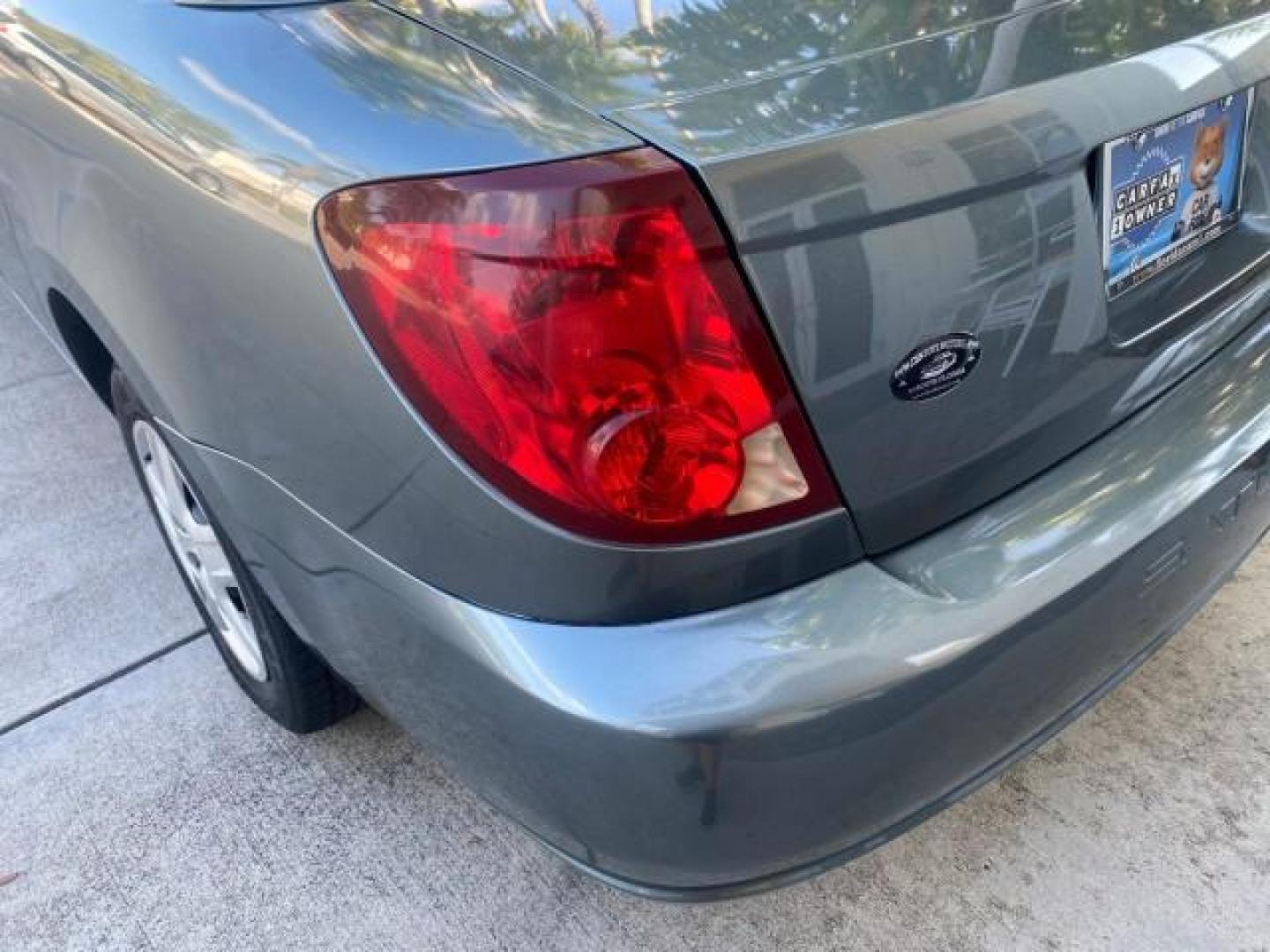 2007 Storm Gray /Black Saturn Ion 3 DR COUPE 1 OWNER FL LO MI 35,356 (1G8AN15F37Z) with an 2.2L DOHC MFI 16-Valve I4 Ecotec Engine engine, Automatic transmission, located at 4701 North Dixie Hwy, Pompano Beach, FL, 33064, (954) 422-2889, 26.240938, -80.123474 - OUR WEBPAGE FLORIDACARS1.COM HAS OVER 100 PHOTOS AND FREE CARFAX LINK VIN: 1G8AN15F37Z152136 1 G 8 A N 1 5 F 3 7 Z 1 5 2 1 3 6 COUPE 4 DR 2.2L I4 F GASOLINE 32 MPG FRONT WHEEL DRIVE Highlighted Features AM/FM Stereo Auxiliary Audio Input Power Locks Rear Defroster Air Conditioning CD Audio Power Mir - Photo#69