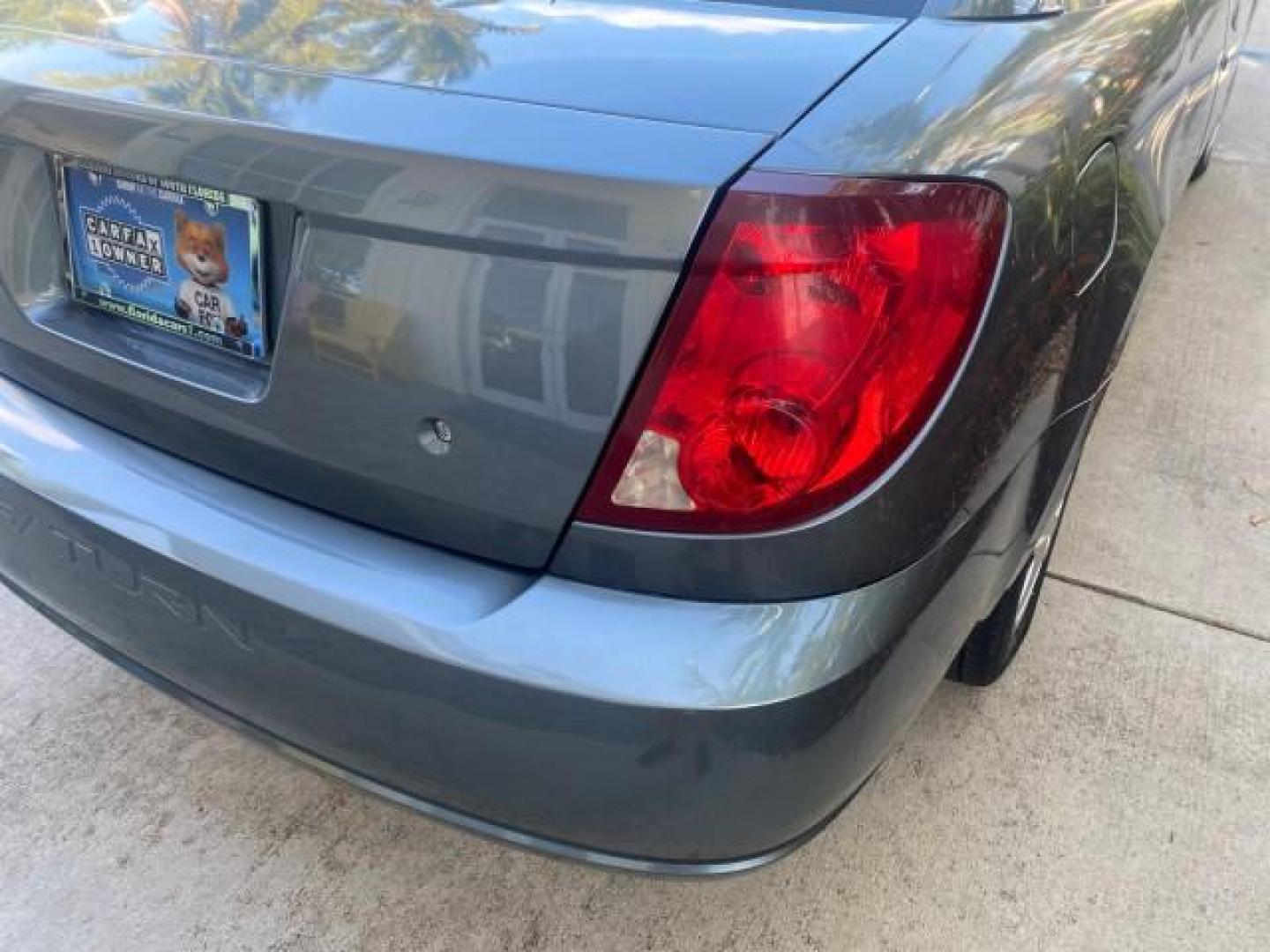 2007 Storm Gray /Black Saturn Ion 3 DR COUPE 1 OWNER FL LO MI 35,356 (1G8AN15F37Z) with an 2.2L DOHC MFI 16-Valve I4 Ecotec Engine engine, Automatic transmission, located at 4701 North Dixie Hwy, Pompano Beach, FL, 33064, (954) 422-2889, 26.240938, -80.123474 - OUR WEBPAGE FLORIDACARS1.COM HAS OVER 100 PHOTOS AND FREE CARFAX LINK VIN: 1G8AN15F37Z152136 1 G 8 A N 1 5 F 3 7 Z 1 5 2 1 3 6 COUPE 4 DR 2.2L I4 F GASOLINE 32 MPG FRONT WHEEL DRIVE Highlighted Features AM/FM Stereo Auxiliary Audio Input Power Locks Rear Defroster Air Conditioning CD Audio Power Mir - Photo#72