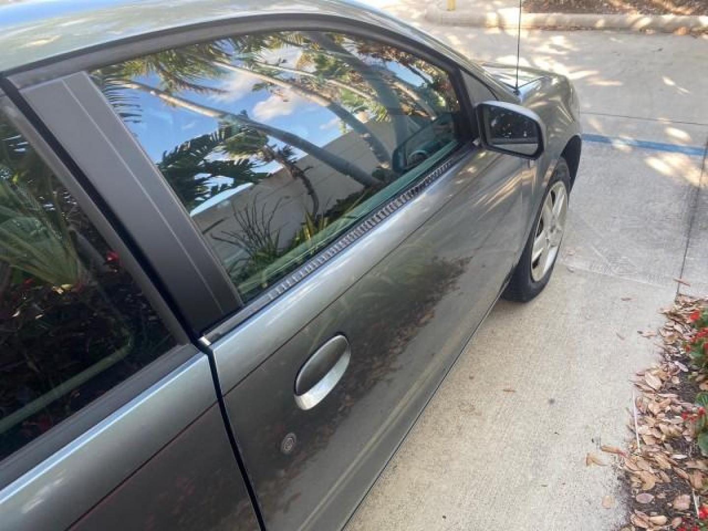 2007 Storm Gray /Black Saturn Ion 3 DR COUPE 1 OWNER FL LO MI 35,356 (1G8AN15F37Z) with an 2.2L DOHC MFI 16-Valve I4 Ecotec Engine engine, Automatic transmission, located at 4701 North Dixie Hwy, Pompano Beach, FL, 33064, (954) 422-2889, 26.240938, -80.123474 - OUR WEBPAGE FLORIDACARS1.COM HAS OVER 100 PHOTOS AND FREE CARFAX LINK VIN: 1G8AN15F37Z152136 1 G 8 A N 1 5 F 3 7 Z 1 5 2 1 3 6 COUPE 4 DR 2.2L I4 F GASOLINE 32 MPG FRONT WHEEL DRIVE Highlighted Features AM/FM Stereo Auxiliary Audio Input Power Locks Rear Defroster Air Conditioning CD Audio Power Mir - Photo#78