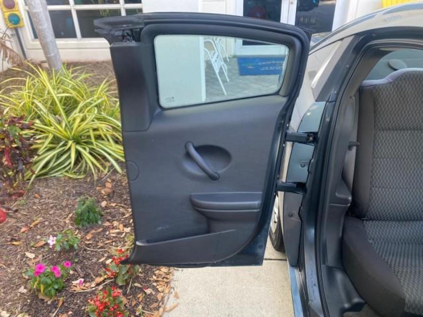 2007 Storm Gray /Black Saturn Ion 3 DR COUPE 1 OWNER FL LO MI 35,356 (1G8AN15F37Z) with an 2.2L DOHC MFI 16-Valve I4 Ecotec Engine engine, Automatic transmission, located at 4701 North Dixie Hwy, Pompano Beach, FL, 33064, (954) 422-2889, 26.240938, -80.123474 - OUR WEBPAGE FLORIDACARS1.COM HAS OVER 100 PHOTOS AND FREE CARFAX LINK VIN: 1G8AN15F37Z152136 1 G 8 A N 1 5 F 3 7 Z 1 5 2 1 3 6 COUPE 4 DR 2.2L I4 F GASOLINE 32 MPG FRONT WHEEL DRIVE Highlighted Features AM/FM Stereo Auxiliary Audio Input Power Locks Rear Defroster Air Conditioning CD Audio Power Mir - Photo#80
