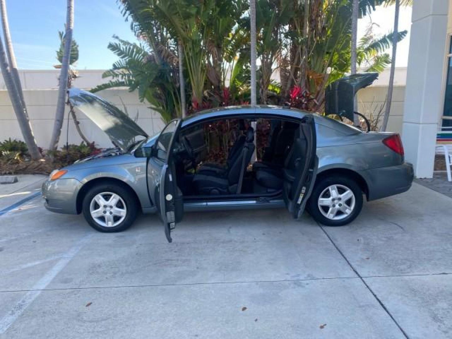 2007 Storm Gray /Black Saturn Ion 3 DR COUPE 1 OWNER FL LO MI 35,356 (1G8AN15F37Z) with an 2.2L DOHC MFI 16-Valve I4 Ecotec Engine engine, Automatic transmission, located at 4701 North Dixie Hwy, Pompano Beach, FL, 33064, (954) 422-2889, 26.240938, -80.123474 - OUR WEBPAGE FLORIDACARS1.COM HAS OVER 100 PHOTOS AND FREE CARFAX LINK VIN: 1G8AN15F37Z152136 1 G 8 A N 1 5 F 3 7 Z 1 5 2 1 3 6 COUPE 4 DR 2.2L I4 F GASOLINE 32 MPG FRONT WHEEL DRIVE Highlighted Features AM/FM Stereo Auxiliary Audio Input Power Locks Rear Defroster Air Conditioning CD Audio Power Mir - Photo#8