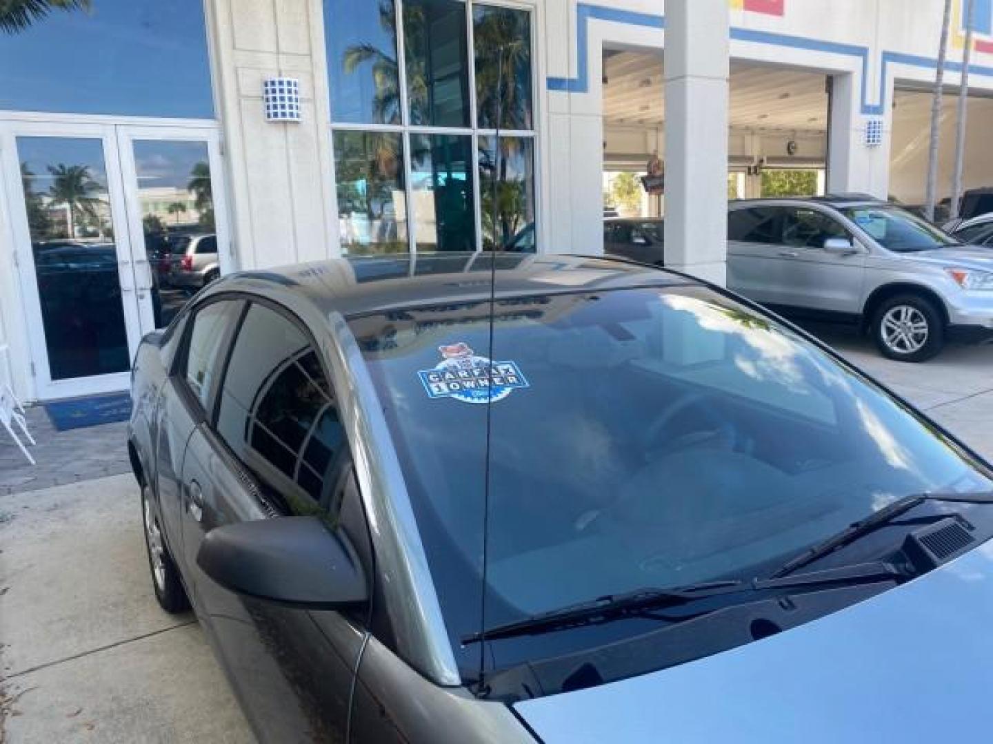 2007 Storm Gray /Black Saturn Ion 3 DR COUPE 1 OWNER FL LO MI 35,356 (1G8AN15F37Z) with an 2.2L DOHC MFI 16-Valve I4 Ecotec Engine engine, Automatic transmission, located at 4701 North Dixie Hwy, Pompano Beach, FL, 33064, (954) 422-2889, 26.240938, -80.123474 - OUR WEBPAGE FLORIDACARS1.COM HAS OVER 100 PHOTOS AND FREE CARFAX LINK VIN: 1G8AN15F37Z152136 1 G 8 A N 1 5 F 3 7 Z 1 5 2 1 3 6 COUPE 4 DR 2.2L I4 F GASOLINE 32 MPG FRONT WHEEL DRIVE Highlighted Features AM/FM Stereo Auxiliary Audio Input Power Locks Rear Defroster Air Conditioning CD Audio Power Mir - Photo#90