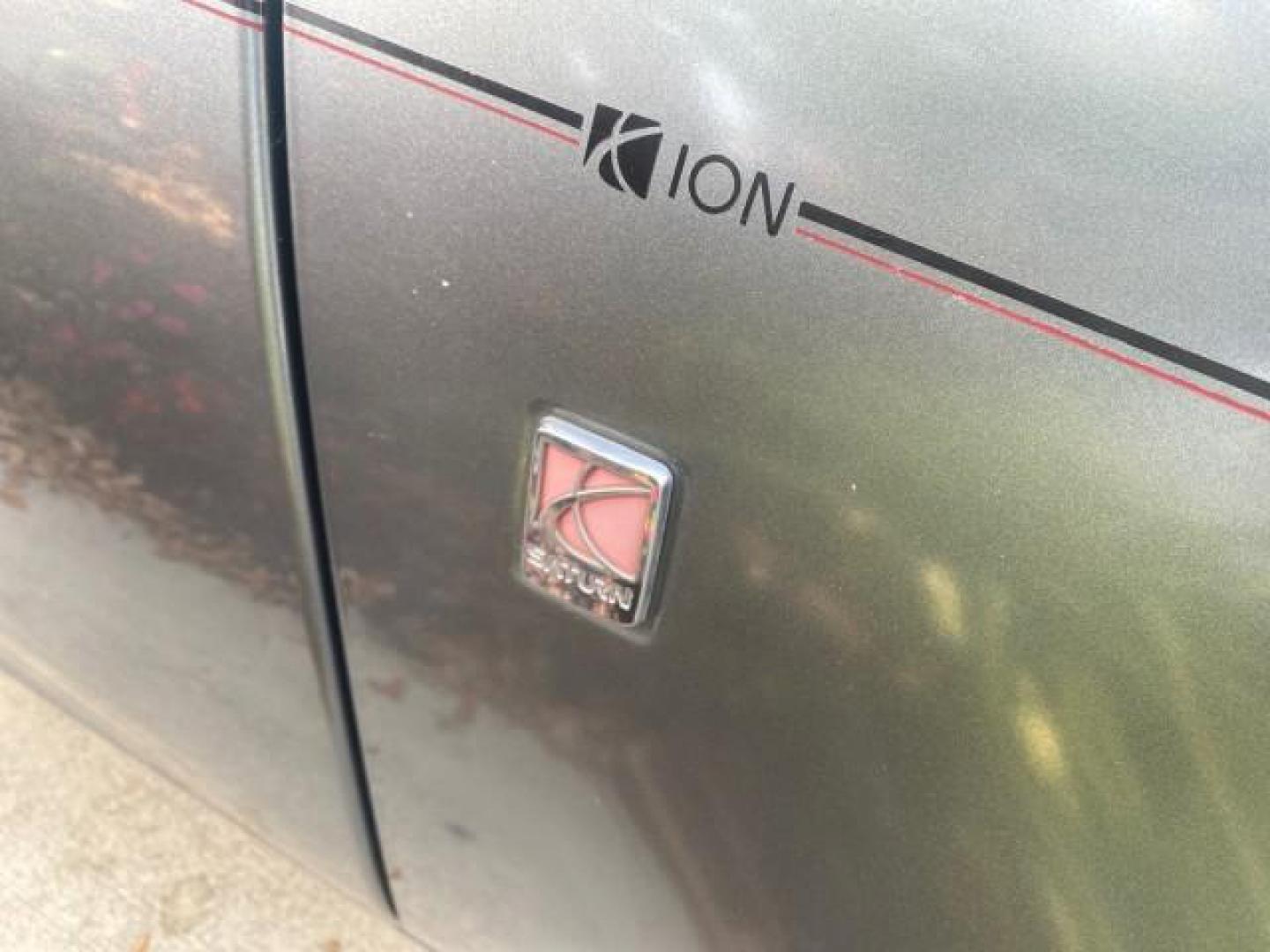 2007 Storm Gray /Black Saturn Ion 3 DR COUPE 1 OWNER FL LO MI 35,356 (1G8AN15F37Z) with an 2.2L DOHC MFI 16-Valve I4 Ecotec Engine engine, Automatic transmission, located at 4701 North Dixie Hwy, Pompano Beach, FL, 33064, (954) 422-2889, 26.240938, -80.123474 - OUR WEBPAGE FLORIDACARS1.COM HAS OVER 100 PHOTOS AND FREE CARFAX LINK VIN: 1G8AN15F37Z152136 1 G 8 A N 1 5 F 3 7 Z 1 5 2 1 3 6 COUPE 4 DR 2.2L I4 F GASOLINE 32 MPG FRONT WHEEL DRIVE Highlighted Features AM/FM Stereo Auxiliary Audio Input Power Locks Rear Defroster Air Conditioning CD Audio Power Mir - Photo#91