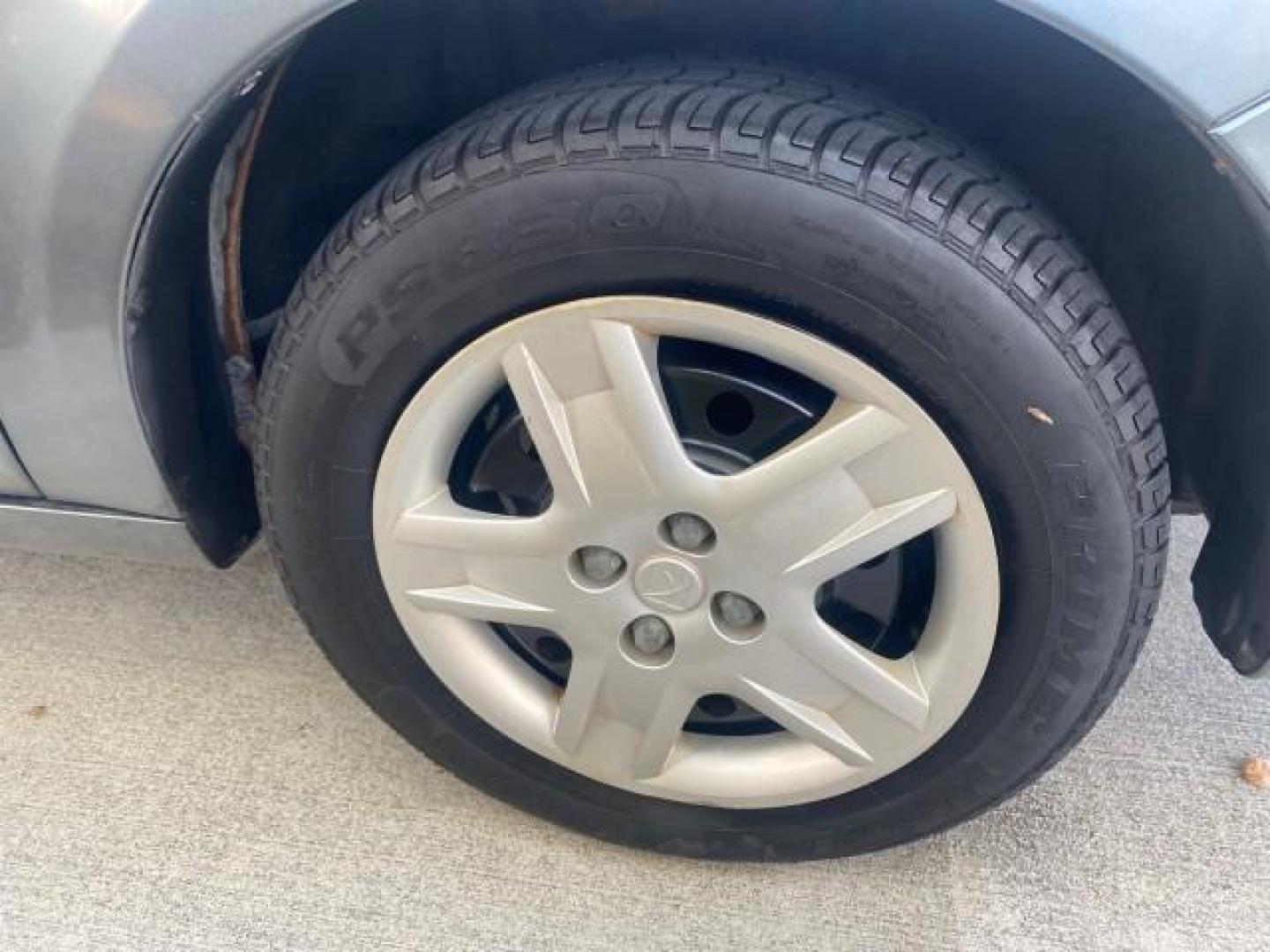 2007 Storm Gray /Black Saturn Ion 3 DR COUPE 1 OWNER FL LO MI 35,356 (1G8AN15F37Z) with an 2.2L DOHC MFI 16-Valve I4 Ecotec Engine engine, Automatic transmission, located at 4701 North Dixie Hwy, Pompano Beach, FL, 33064, (954) 422-2889, 26.240938, -80.123474 - OUR WEBPAGE FLORIDACARS1.COM HAS OVER 100 PHOTOS AND FREE CARFAX LINK VIN: 1G8AN15F37Z152136 1 G 8 A N 1 5 F 3 7 Z 1 5 2 1 3 6 COUPE 4 DR 2.2L I4 F GASOLINE 32 MPG FRONT WHEEL DRIVE Highlighted Features AM/FM Stereo Auxiliary Audio Input Power Locks Rear Defroster Air Conditioning CD Audio Power Mir - Photo#92