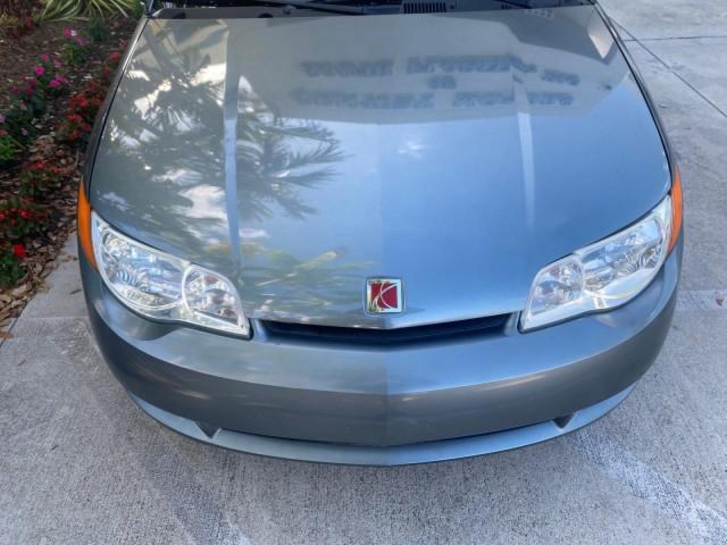 2007 Storm Gray /Black Saturn Ion 3 DR COUPE 1 OWNER FL LO MI 35,356 (1G8AN15F37Z) with an 2.2L DOHC MFI 16-Valve I4 Ecotec Engine engine, Automatic transmission, located at 4701 North Dixie Hwy, Pompano Beach, FL, 33064, (954) 422-2889, 26.240938, -80.123474 - OUR WEBPAGE FLORIDACARS1.COM HAS OVER 100 PHOTOS AND FREE CARFAX LINK VIN: 1G8AN15F37Z152136 1 G 8 A N 1 5 F 3 7 Z 1 5 2 1 3 6 COUPE 4 DR 2.2L I4 F GASOLINE 32 MPG FRONT WHEEL DRIVE Highlighted Features AM/FM Stereo Auxiliary Audio Input Power Locks Rear Defroster Air Conditioning CD Audio Power Mir - Photo#95