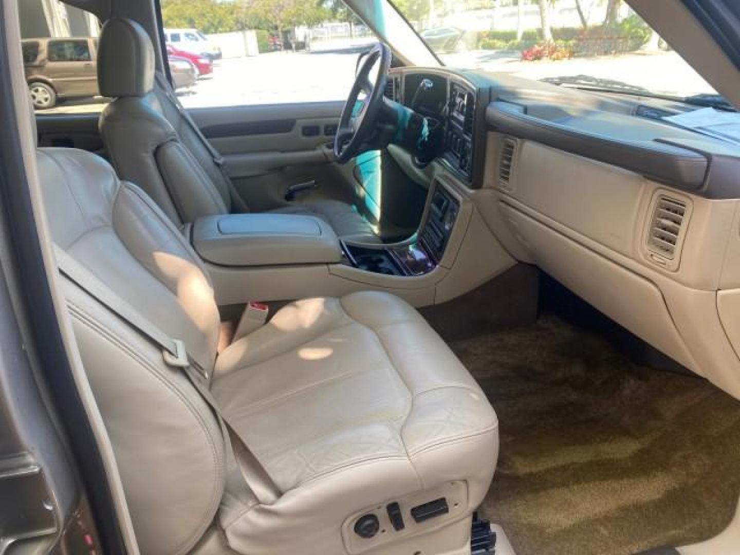 2002 Silver Sand /Shale Cadillac Escalade AWD I OWNER NO ACCIDENTS (1GYEK63N72R) with an 6.0L Vortec 1000 SFI V8 HO Engine engine, Automatic transmission, located at 4701 North Dixie Hwy, Pompano Beach, FL, 33064, (954) 422-2889, 26.240938, -80.123474 - OUR WEBPAGE FLORIDACARS1.COM HAS OVER 100 PHOTOS AND FREE CARFAX LINK 2002 CADILLAC ESCALADE VIN: 1GYEK63N72R215443 1 G Y E K 6 3 N 7 2 R 2 1 5 4 4 3 4 DOOR WAGON/SPORT UTILITY 6.0L V8 F GASOLINE ALL WHEEL DRIVE Top Features Alloy Wheels Running Boards Bed Liner Tow Hitch Cloth Seats Basic Features - Photo#12