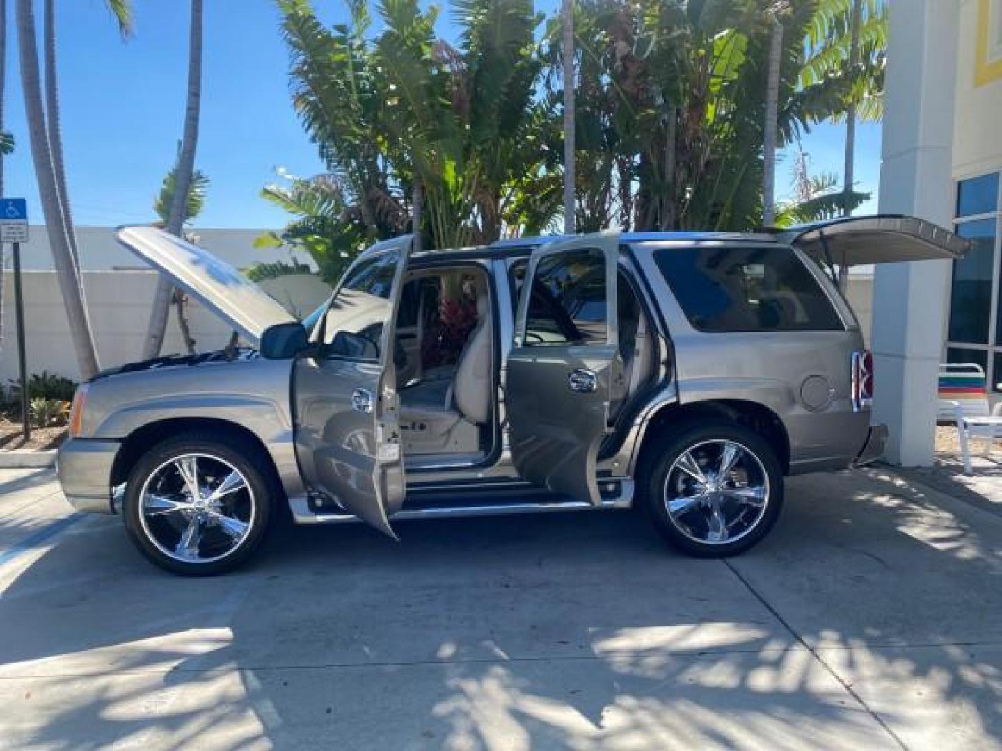 2002 Silver Sand /Shale Cadillac Escalade AWD I OWNER NO ACCIDENTS (1GYEK63N72R) with an 6.0L Vortec 1000 SFI V8 HO Engine engine, Automatic transmission, located at 4701 North Dixie Hwy, Pompano Beach, FL, 33064, (954) 422-2889, 26.240938, -80.123474 - OUR WEBPAGE FLORIDACARS1.COM HAS OVER 100 PHOTOS AND FREE CARFAX LINK 2002 CADILLAC ESCALADE VIN: 1GYEK63N72R215443 1 G Y E K 6 3 N 7 2 R 2 1 5 4 4 3 4 DOOR WAGON/SPORT UTILITY 6.0L V8 F GASOLINE ALL WHEEL DRIVE Top Features Alloy Wheels Running Boards Bed Liner Tow Hitch Cloth Seats Basic Features - Photo#8