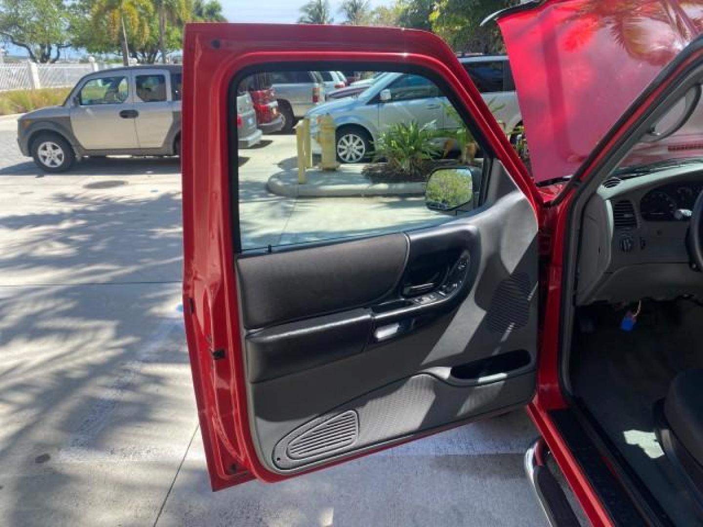 2005 Bright Red /Medium Dk Flint Ford Ranger XLT X CAB LOW MILES 55,254 (1FTZR14U75P) with an 3.0L MPFI V6 Engine engine, Automatic transmission, located at 4701 North Dixie Hwy, Pompano Beach, FL, 33064, (954) 422-2889, 26.240938, -80.123474 - OUR WEBPAGE FLORIDACARS1.COM HAS OVER 100 PHOTOS AND FREE CARFAX LINK 2005 FORD RANGER XLT XCAB VIN: 1FTZR14U75PA45984 1 F T Z R 1 4 U 7 5 P A 4 5 9 8 4 CLUB CAB PICKUP 3.0L V6 F 12V GASOLINE TOW PKG UPGRADED STEREO SYSTEM AND MORE REAR WHEEL DRIVE Top Features Alloy Wheels Running Boards Bed Liner - Photo#9