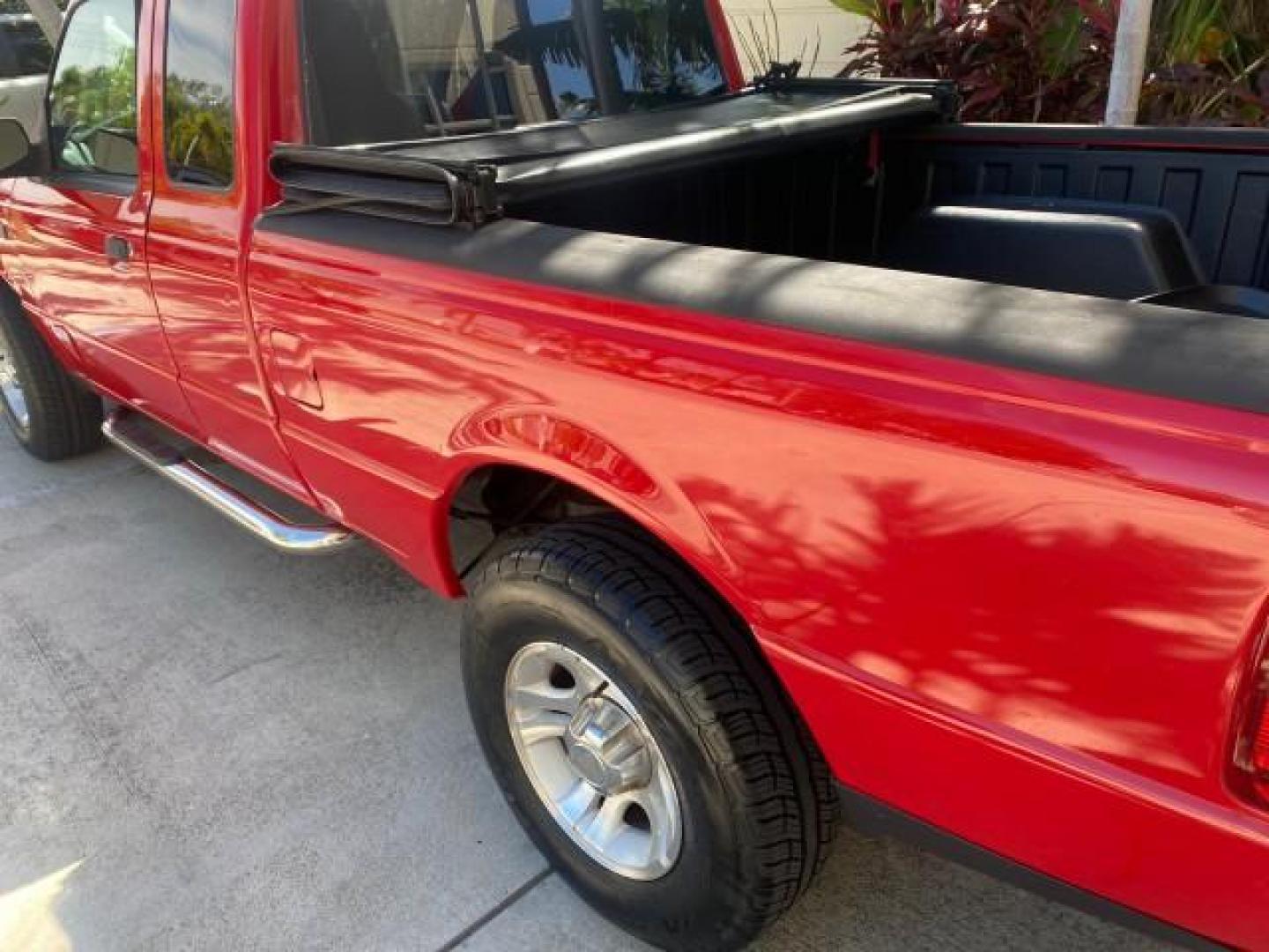 2005 Bright Red /Medium Dk Flint Ford Ranger XLT X CAB LOW MILES 55,254 (1FTZR14U75P) with an 3.0L MPFI V6 Engine engine, Automatic transmission, located at 4701 North Dixie Hwy, Pompano Beach, FL, 33064, (954) 422-2889, 26.240938, -80.123474 - OUR WEBPAGE FLORIDACARS1.COM HAS OVER 100 PHOTOS AND FREE CARFAX LINK 2005 FORD RANGER XLT XCAB VIN: 1FTZR14U75PA45984 1 F T Z R 1 4 U 7 5 P A 4 5 9 8 4 CLUB CAB PICKUP 3.0L V6 F 12V GASOLINE TOW PKG UPGRADED STEREO SYSTEM AND MORE REAR WHEEL DRIVE Top Features Alloy Wheels Running Boards Bed Liner - Photo#13