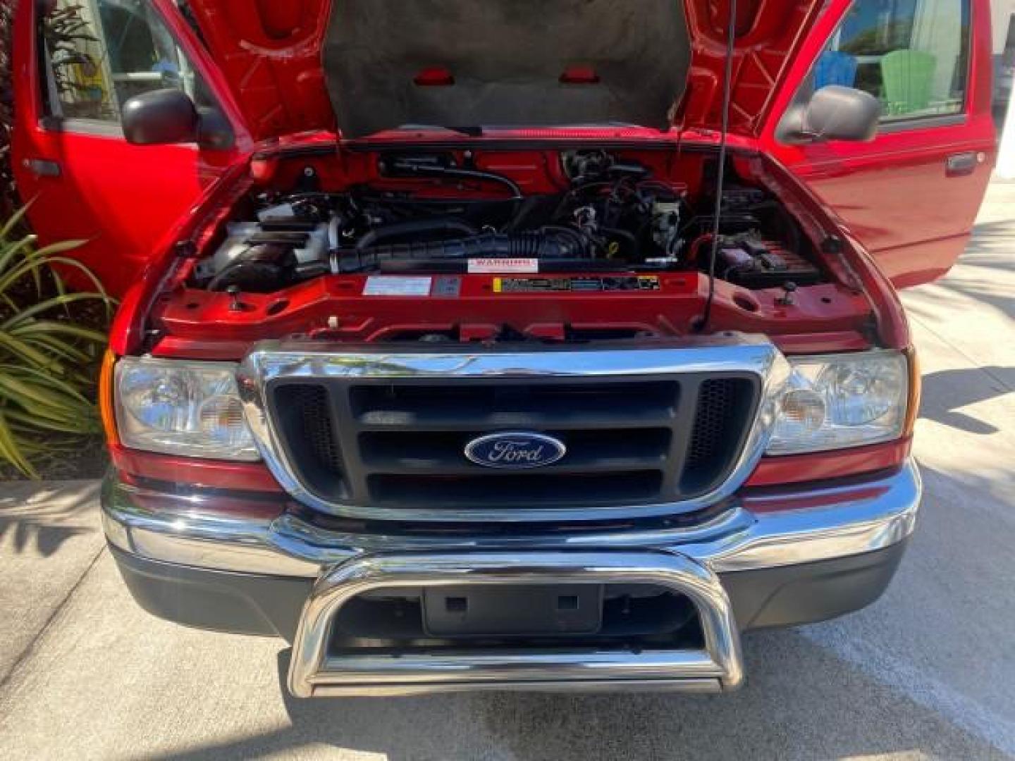 2005 Bright Red /Medium Dk Flint Ford Ranger XLT X CAB LOW MILES 55,254 (1FTZR14U75P) with an 3.0L MPFI V6 Engine engine, Automatic transmission, located at 4701 North Dixie Hwy, Pompano Beach, FL, 33064, (954) 422-2889, 26.240938, -80.123474 - OUR WEBPAGE FLORIDACARS1.COM HAS OVER 100 PHOTOS AND FREE CARFAX LINK 2005 FORD RANGER XLT XCAB VIN: 1FTZR14U75PA45984 1 F T Z R 1 4 U 7 5 P A 4 5 9 8 4 CLUB CAB PICKUP 3.0L V6 F 12V GASOLINE TOW PKG UPGRADED STEREO SYSTEM AND MORE REAR WHEEL DRIVE Top Features Alloy Wheels Running Boards Bed Liner - Photo#16