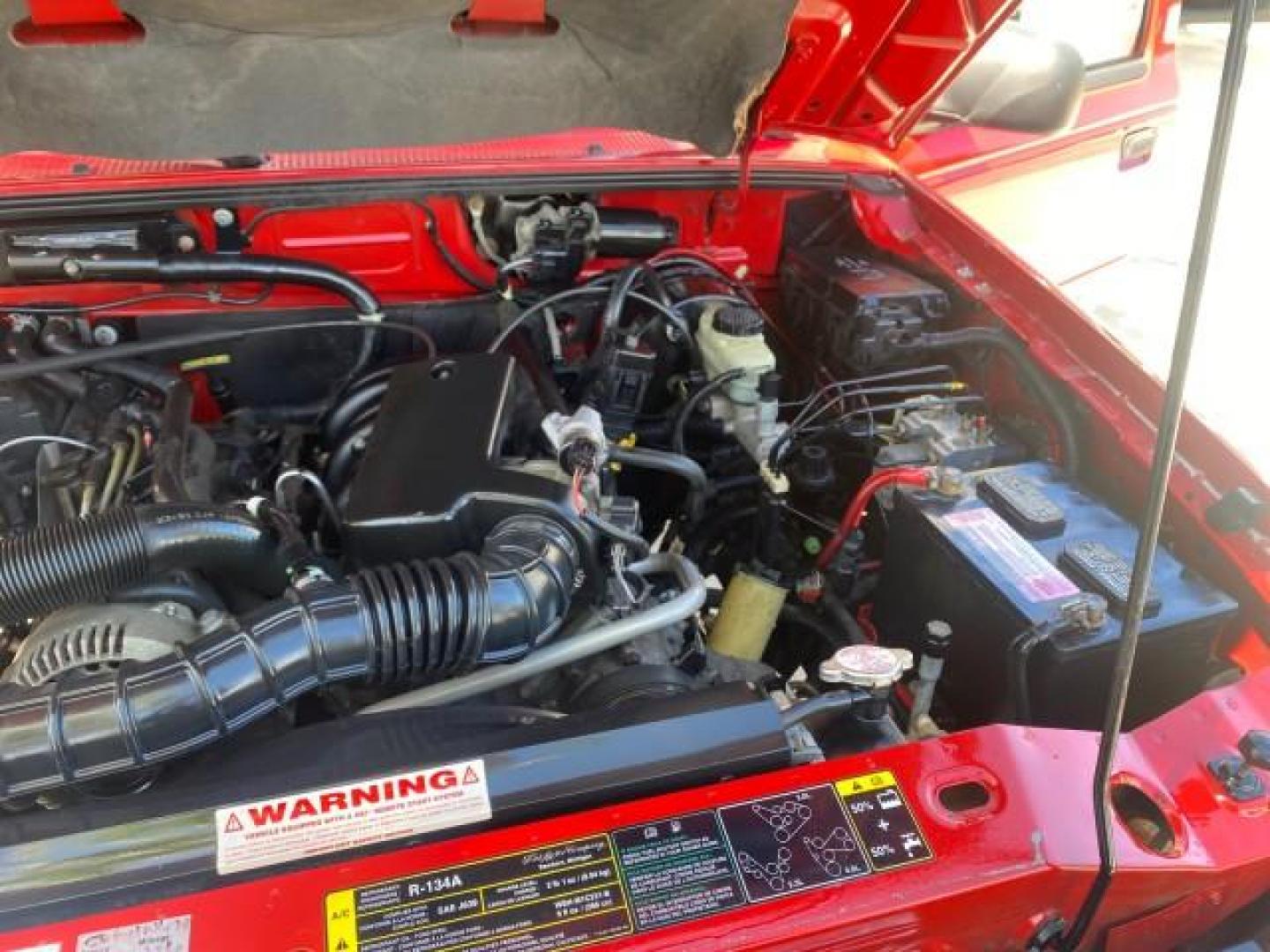 2005 Bright Red /Medium Dk Flint Ford Ranger XLT X CAB LOW MILES 55,254 (1FTZR14U75P) with an 3.0L MPFI V6 Engine engine, Automatic transmission, located at 4701 North Dixie Hwy, Pompano Beach, FL, 33064, (954) 422-2889, 26.240938, -80.123474 - OUR WEBPAGE FLORIDACARS1.COM HAS OVER 100 PHOTOS AND FREE CARFAX LINK 2005 FORD RANGER XLT XCAB VIN: 1FTZR14U75PA45984 1 F T Z R 1 4 U 7 5 P A 4 5 9 8 4 CLUB CAB PICKUP 3.0L V6 F 12V GASOLINE TOW PKG UPGRADED STEREO SYSTEM AND MORE REAR WHEEL DRIVE Top Features Alloy Wheels Running Boards Bed Liner - Photo#25