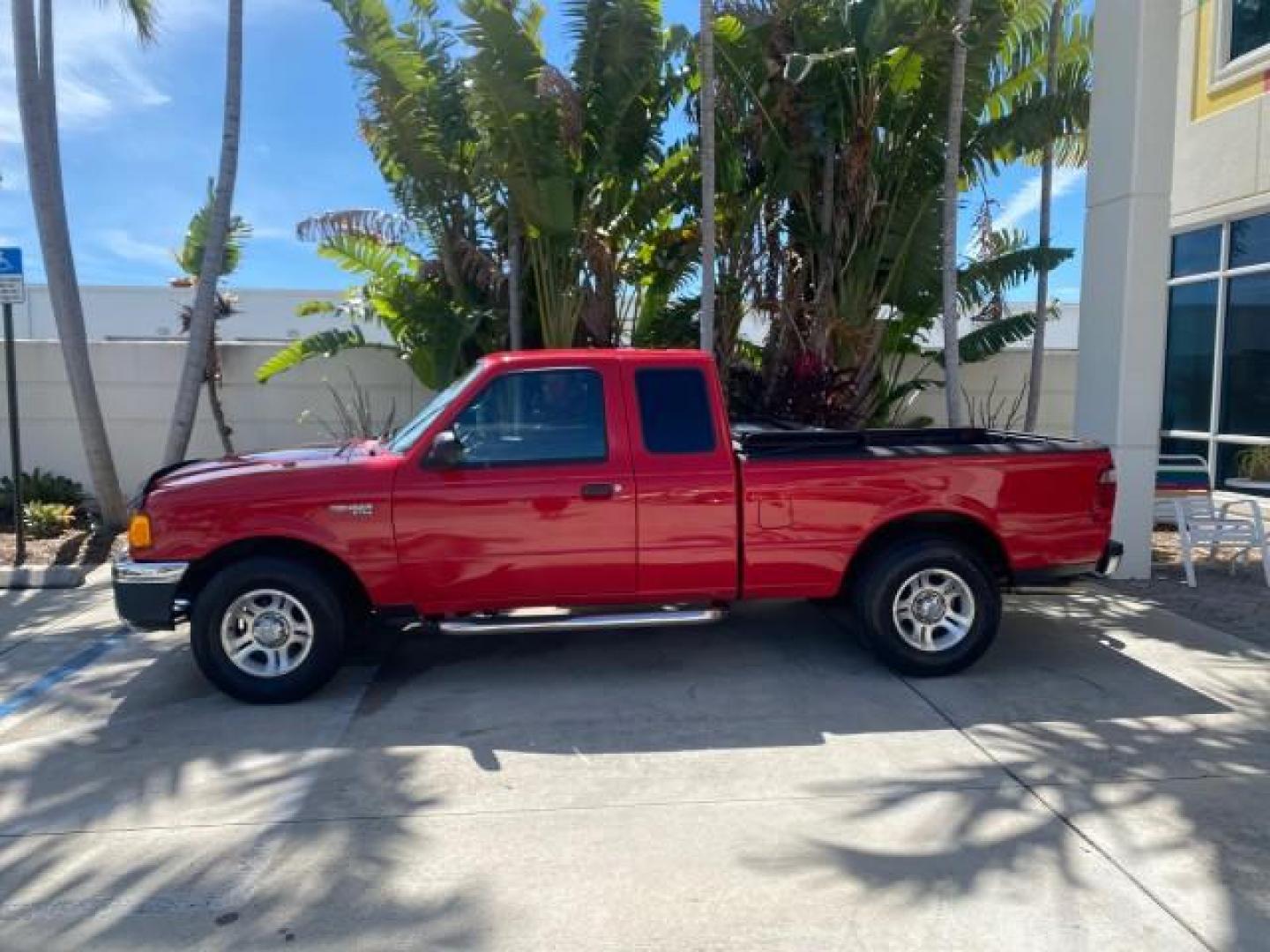 2005 Bright Red /Medium Dk Flint Ford Ranger XLT X CAB LOW MILES 55,254 (1FTZR14U75P) with an 3.0L MPFI V6 Engine engine, Automatic transmission, located at 4701 North Dixie Hwy, Pompano Beach, FL, 33064, (954) 422-2889, 26.240938, -80.123474 - OUR WEBPAGE FLORIDACARS1.COM HAS OVER 100 PHOTOS AND FREE CARFAX LINK 2005 FORD RANGER XLT XCAB VIN: 1FTZR14U75PA45984 1 F T Z R 1 4 U 7 5 P A 4 5 9 8 4 CLUB CAB PICKUP 3.0L V6 F 12V GASOLINE TOW PKG UPGRADED STEREO SYSTEM AND MORE REAR WHEEL DRIVE Top Features Alloy Wheels Running Boards Bed Liner - Photo#4