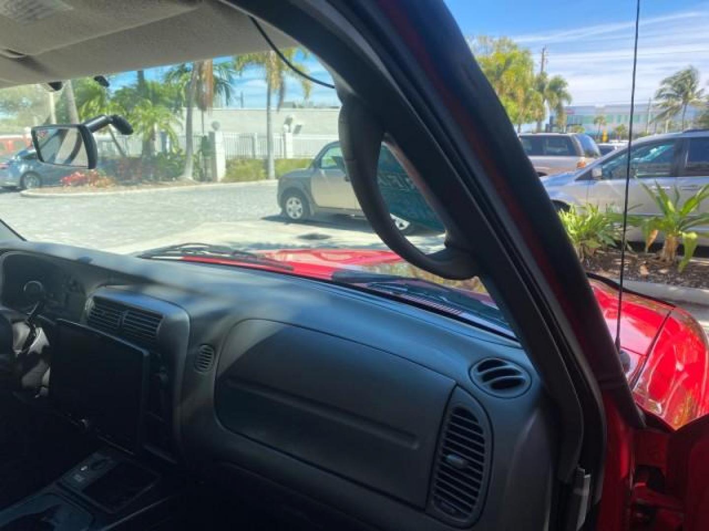 2005 Bright Red /Medium Dk Flint Ford Ranger XLT X CAB LOW MILES 55,254 (1FTZR14U75P) with an 3.0L MPFI V6 Engine engine, Automatic transmission, located at 4701 North Dixie Hwy, Pompano Beach, FL, 33064, (954) 422-2889, 26.240938, -80.123474 - OUR WEBPAGE FLORIDACARS1.COM HAS OVER 100 PHOTOS AND FREE CARFAX LINK 2005 FORD RANGER XLT XCAB VIN: 1FTZR14U75PA45984 1 F T Z R 1 4 U 7 5 P A 4 5 9 8 4 CLUB CAB PICKUP 3.0L V6 F 12V GASOLINE TOW PKG UPGRADED STEREO SYSTEM AND MORE REAR WHEEL DRIVE Top Features Alloy Wheels Running Boards Bed Liner - Photo#71