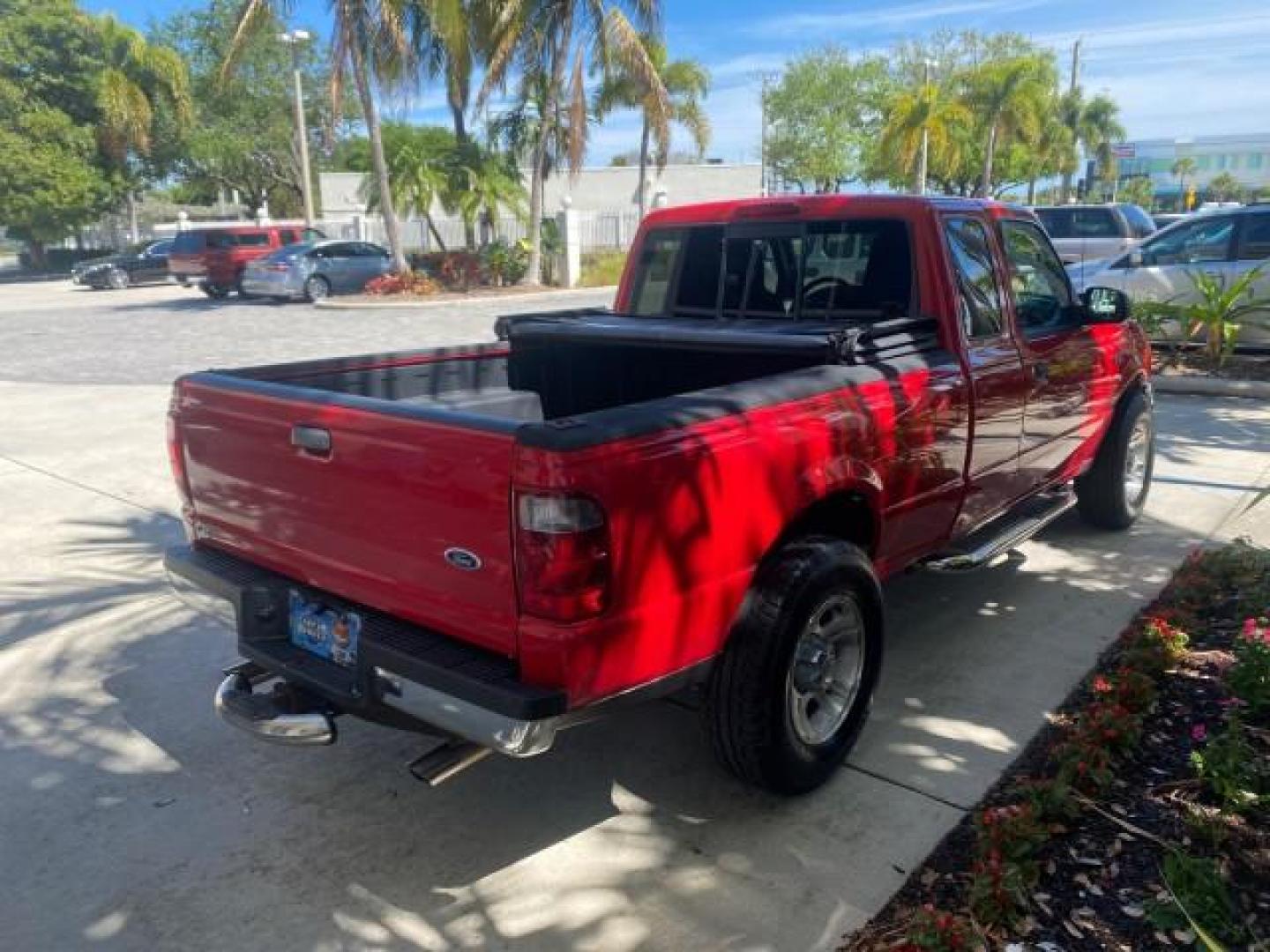 2005 Bright Red /Medium Dk Flint Ford Ranger XLT X CAB LOW MILES 55,254 (1FTZR14U75P) with an 3.0L MPFI V6 Engine engine, Automatic transmission, located at 4701 North Dixie Hwy, Pompano Beach, FL, 33064, (954) 422-2889, 26.240938, -80.123474 - OUR WEBPAGE FLORIDACARS1.COM HAS OVER 100 PHOTOS AND FREE CARFAX LINK 2005 FORD RANGER XLT XCAB VIN: 1FTZR14U75PA45984 1 F T Z R 1 4 U 7 5 P A 4 5 9 8 4 CLUB CAB PICKUP 3.0L V6 F 12V GASOLINE TOW PKG UPGRADED STEREO SYSTEM AND MORE REAR WHEEL DRIVE Top Features Alloy Wheels Running Boards Bed Liner - Photo#7