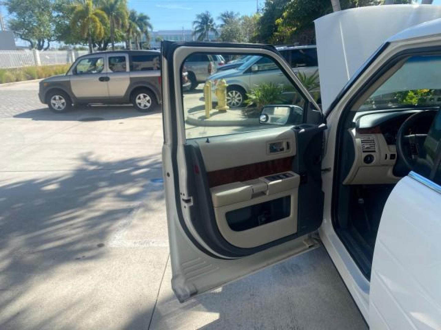 2009 White Suede /Medium Light Stone Ford Flex Limited LEATHER SUNROOF (2FMDK53C99B) with an 3.5L V6 Duratec Engine engine, Automatic transmission, located at 4701 North Dixie Hwy, Pompano Beach, FL, 33064, (954) 422-2889, 26.240938, -80.123474 - OUR WEBPAGE FLORIDACARS1.COM HAS OVER 100 PHOTOS AND FREE CARFAX LINK 2009 FORD FLEX VIN: 2FMDK53C99BA12573 4 DOOR LIMITED FWD 3.5L V6 DURATEC ENGINE GASOLINE FRONT WHEEL DRIVE Highlighted Features Bed Liner Cloth Seats ABS Brakes Automatic Transmission Power Locks AM/FM Stereo CD Audio Power Mirror - Photo#9