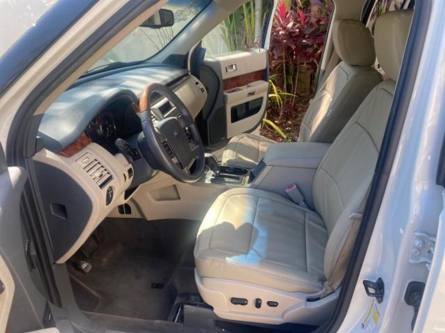 2009 White Suede /Medium Light Stone Ford Flex Limited LEATHER SUNROOF (2FMDK53C99B) with an 3.5L V6 Duratec Engine engine, Automatic transmission, located at 4701 North Dixie Hwy, Pompano Beach, FL, 33064, (954) 422-2889, 26.240938, -80.123474 - OUR WEBPAGE FLORIDACARS1.COM HAS OVER 100 PHOTOS AND FREE CARFAX LINK 2009 FORD FLEX VIN: 2FMDK53C99BA12573 4 DOOR LIMITED FWD 3.5L V6 DURATEC ENGINE GASOLINE FRONT WHEEL DRIVE Highlighted Features Bed Liner Cloth Seats ABS Brakes Automatic Transmission Power Locks AM/FM Stereo CD Audio Power Mirror - Photo#10