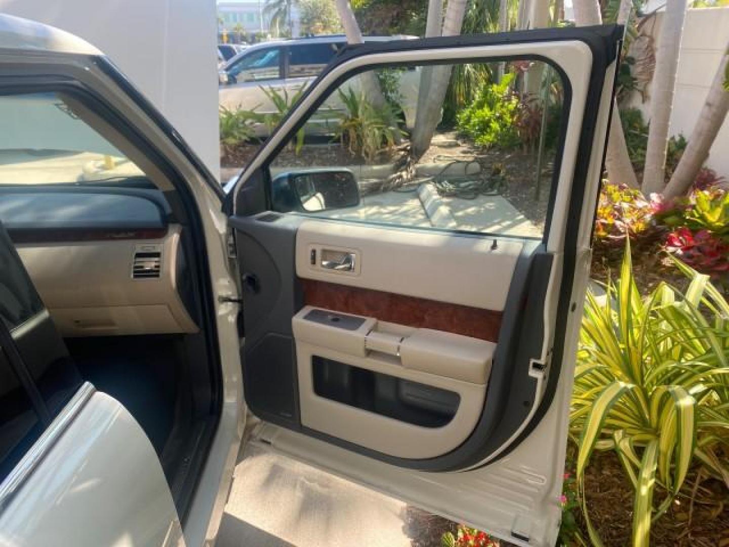 2009 White Suede /Medium Light Stone Ford Flex Limited LEATHER SUNROOF (2FMDK53C99B) with an 3.5L V6 Duratec Engine engine, Automatic transmission, located at 4701 North Dixie Hwy, Pompano Beach, FL, 33064, (954) 422-2889, 26.240938, -80.123474 - OUR WEBPAGE FLORIDACARS1.COM HAS OVER 100 PHOTOS AND FREE CARFAX LINK 2009 FORD FLEX VIN: 2FMDK53C99BA12573 4 DOOR LIMITED FWD 3.5L V6 DURATEC ENGINE GASOLINE FRONT WHEEL DRIVE Highlighted Features Bed Liner Cloth Seats ABS Brakes Automatic Transmission Power Locks AM/FM Stereo CD Audio Power Mirror - Photo#11