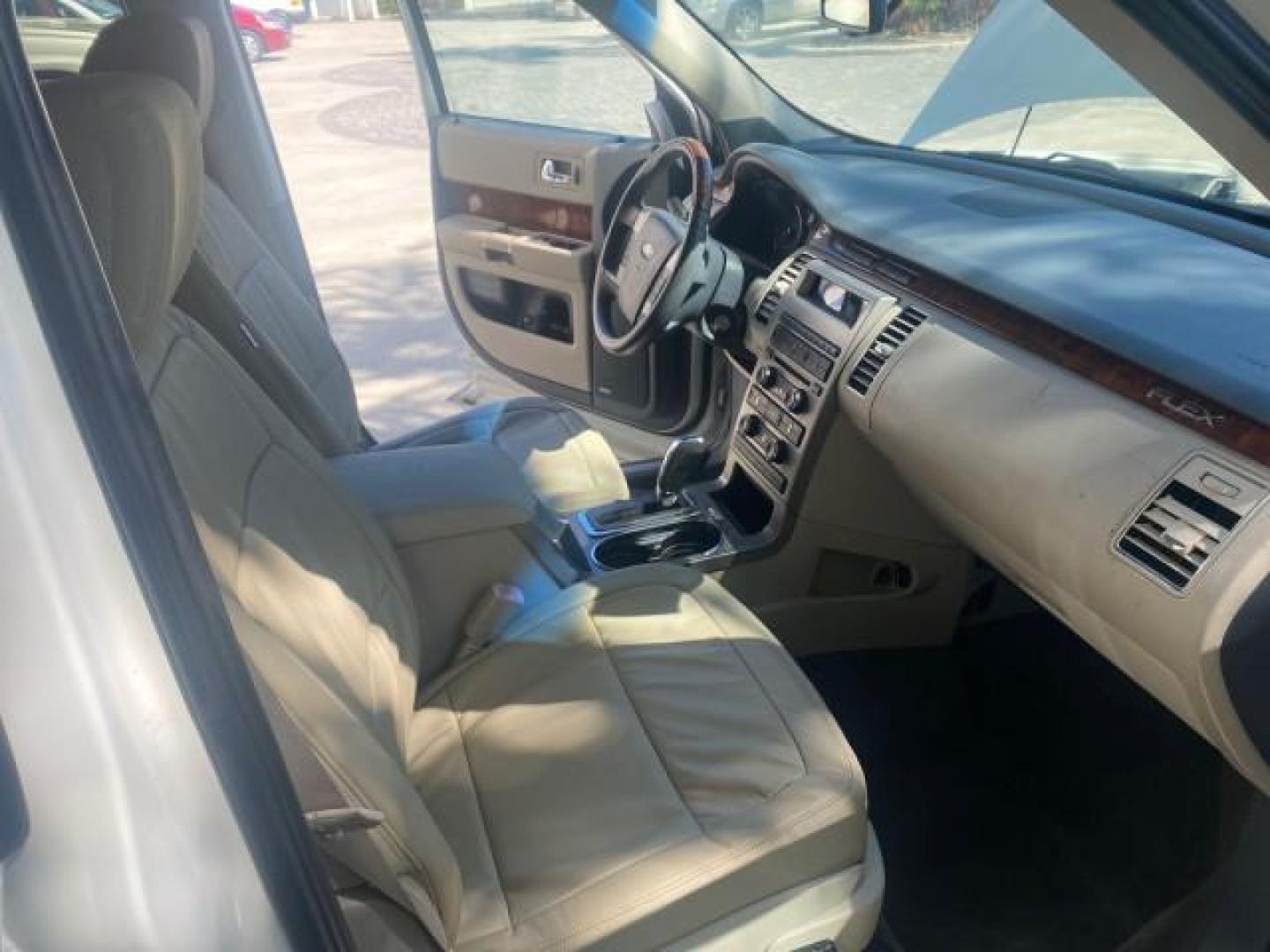 2009 White Suede /Medium Light Stone Ford Flex Limited LEATHER SUNROOF (2FMDK53C99B) with an 3.5L V6 Duratec Engine engine, Automatic transmission, located at 4701 North Dixie Hwy, Pompano Beach, FL, 33064, (954) 422-2889, 26.240938, -80.123474 - OUR WEBPAGE FLORIDACARS1.COM HAS OVER 100 PHOTOS AND FREE CARFAX LINK 2009 FORD FLEX VIN: 2FMDK53C99BA12573 4 DOOR LIMITED FWD 3.5L V6 DURATEC ENGINE GASOLINE FRONT WHEEL DRIVE Highlighted Features Bed Liner Cloth Seats ABS Brakes Automatic Transmission Power Locks AM/FM Stereo CD Audio Power Mirror - Photo#12