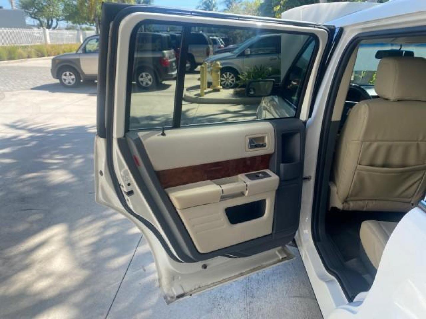 2009 White Suede /Medium Light Stone Ford Flex Limited LEATHER SUNROOF (2FMDK53C99B) with an 3.5L V6 Duratec Engine engine, Automatic transmission, located at 4701 North Dixie Hwy, Pompano Beach, FL, 33064, (954) 422-2889, 26.240938, -80.123474 - OUR WEBPAGE FLORIDACARS1.COM HAS OVER 100 PHOTOS AND FREE CARFAX LINK 2009 FORD FLEX VIN: 2FMDK53C99BA12573 4 DOOR LIMITED FWD 3.5L V6 DURATEC ENGINE GASOLINE FRONT WHEEL DRIVE Highlighted Features Bed Liner Cloth Seats ABS Brakes Automatic Transmission Power Locks AM/FM Stereo CD Audio Power Mirror - Photo#13