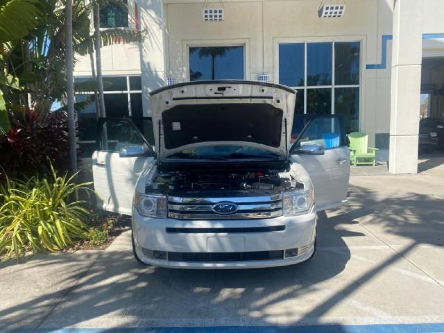 2009 White Suede /Medium Light Stone Ford Flex Limited LEATHER SUNROOF (2FMDK53C99B) with an 3.5L V6 Duratec Engine engine, Automatic transmission, located at 4701 North Dixie Hwy, Pompano Beach, FL, 33064, (954) 422-2889, 26.240938, -80.123474 - OUR WEBPAGE FLORIDACARS1.COM HAS OVER 100 PHOTOS AND FREE CARFAX LINK 2009 FORD FLEX VIN: 2FMDK53C99BA12573 4 DOOR LIMITED FWD 3.5L V6 DURATEC ENGINE GASOLINE FRONT WHEEL DRIVE Highlighted Features Bed Liner Cloth Seats ABS Brakes Automatic Transmission Power Locks AM/FM Stereo CD Audio Power Mirror - Photo#16