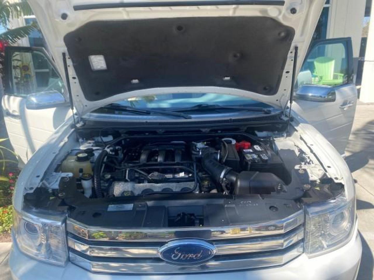 2009 White Suede /Medium Light Stone Ford Flex Limited LEATHER SUNROOF (2FMDK53C99B) with an 3.5L V6 Duratec Engine engine, Automatic transmission, located at 4701 North Dixie Hwy, Pompano Beach, FL, 33064, (954) 422-2889, 26.240938, -80.123474 - OUR WEBPAGE FLORIDACARS1.COM HAS OVER 100 PHOTOS AND FREE CARFAX LINK 2009 FORD FLEX VIN: 2FMDK53C99BA12573 4 DOOR LIMITED FWD 3.5L V6 DURATEC ENGINE GASOLINE FRONT WHEEL DRIVE Highlighted Features Bed Liner Cloth Seats ABS Brakes Automatic Transmission Power Locks AM/FM Stereo CD Audio Power Mirror - Photo#17