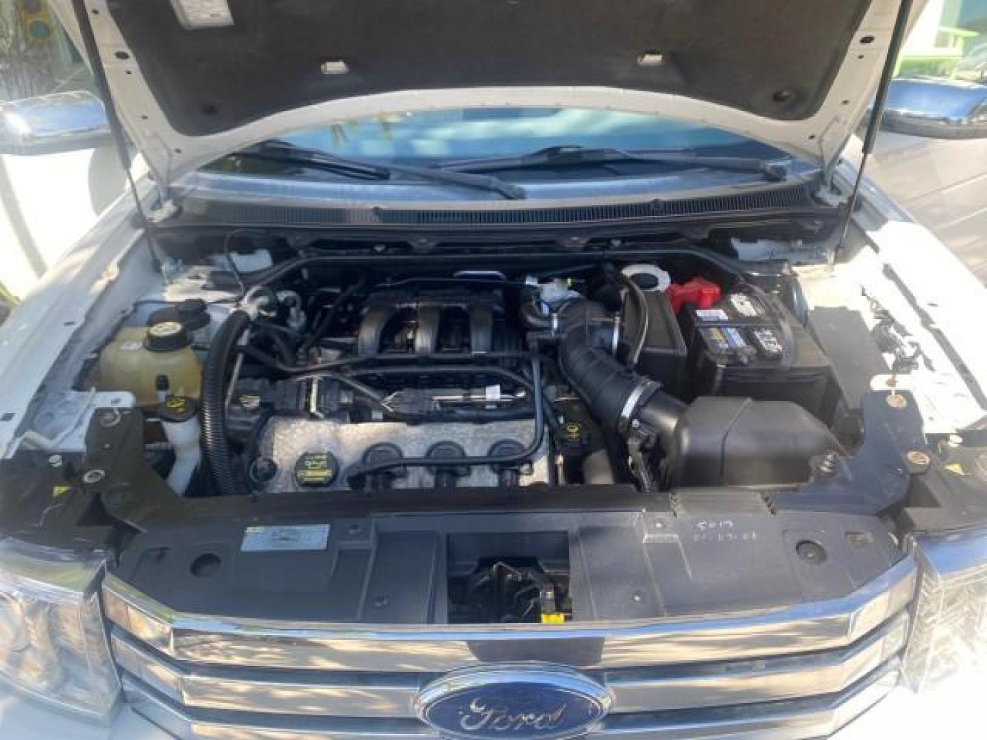 2009 White Suede /Medium Light Stone Ford Flex Limited LEATHER SUNROOF (2FMDK53C99B) with an 3.5L V6 Duratec Engine engine, Automatic transmission, located at 4701 North Dixie Hwy, Pompano Beach, FL, 33064, (954) 422-2889, 26.240938, -80.123474 - OUR WEBPAGE FLORIDACARS1.COM HAS OVER 100 PHOTOS AND FREE CARFAX LINK 2009 FORD FLEX VIN: 2FMDK53C99BA12573 4 DOOR LIMITED FWD 3.5L V6 DURATEC ENGINE GASOLINE FRONT WHEEL DRIVE Highlighted Features Bed Liner Cloth Seats ABS Brakes Automatic Transmission Power Locks AM/FM Stereo CD Audio Power Mirror - Photo#24