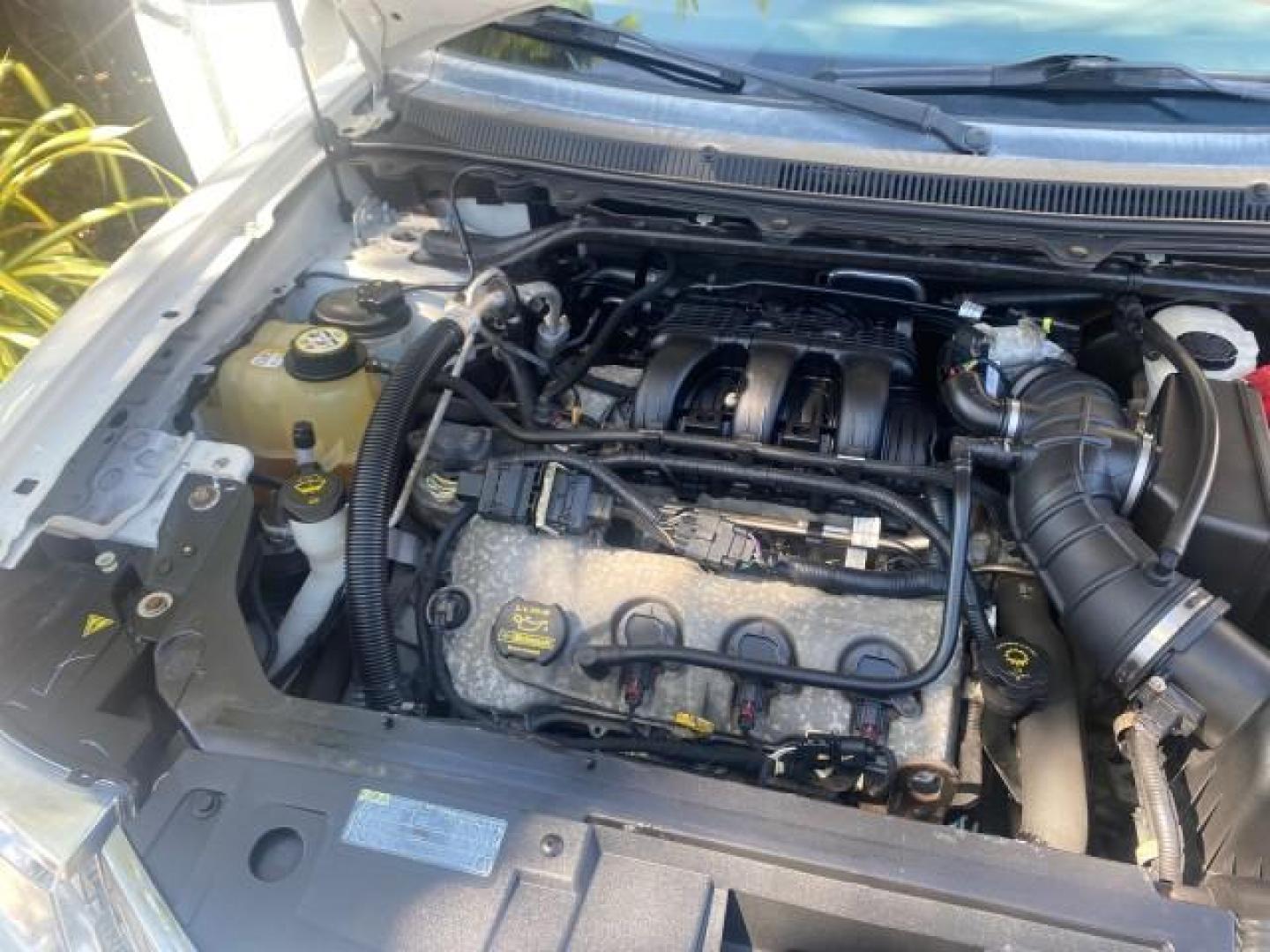 2009 White Suede /Medium Light Stone Ford Flex Limited LEATHER SUNROOF (2FMDK53C99B) with an 3.5L V6 Duratec Engine engine, Automatic transmission, located at 4701 North Dixie Hwy, Pompano Beach, FL, 33064, (954) 422-2889, 26.240938, -80.123474 - OUR WEBPAGE FLORIDACARS1.COM HAS OVER 100 PHOTOS AND FREE CARFAX LINK 2009 FORD FLEX VIN: 2FMDK53C99BA12573 4 DOOR LIMITED FWD 3.5L V6 DURATEC ENGINE GASOLINE FRONT WHEEL DRIVE Highlighted Features Bed Liner Cloth Seats ABS Brakes Automatic Transmission Power Locks AM/FM Stereo CD Audio Power Mirror - Photo#25