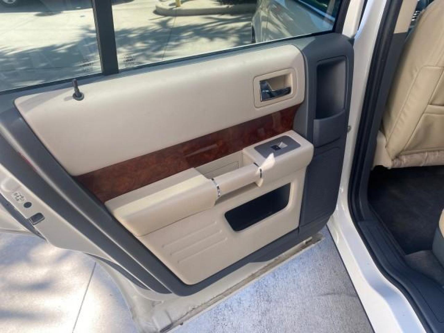 2009 White Suede /Medium Light Stone Ford Flex Limited LEATHER SUNROOF (2FMDK53C99B) with an 3.5L V6 Duratec Engine engine, Automatic transmission, located at 4701 North Dixie Hwy, Pompano Beach, FL, 33064, (954) 422-2889, 26.240938, -80.123474 - OUR WEBPAGE FLORIDACARS1.COM HAS OVER 100 PHOTOS AND FREE CARFAX LINK 2009 FORD FLEX VIN: 2FMDK53C99BA12573 4 DOOR LIMITED FWD 3.5L V6 DURATEC ENGINE GASOLINE FRONT WHEEL DRIVE Highlighted Features Bed Liner Cloth Seats ABS Brakes Automatic Transmission Power Locks AM/FM Stereo CD Audio Power Mirror - Photo#58