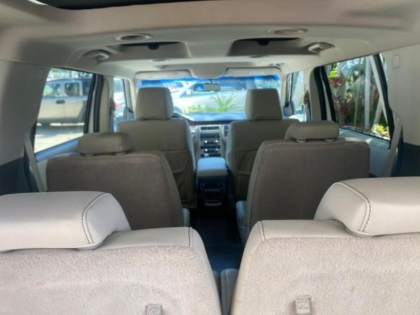 2009 White Suede /Medium Light Stone Ford Flex Limited LEATHER SUNROOF (2FMDK53C99B) with an 3.5L V6 Duratec Engine engine, Automatic transmission, located at 4701 North Dixie Hwy, Pompano Beach, FL, 33064, (954) 422-2889, 26.240938, -80.123474 - OUR WEBPAGE FLORIDACARS1.COM HAS OVER 100 PHOTOS AND FREE CARFAX LINK 2009 FORD FLEX VIN: 2FMDK53C99BA12573 4 DOOR LIMITED FWD 3.5L V6 DURATEC ENGINE GASOLINE FRONT WHEEL DRIVE Highlighted Features Bed Liner Cloth Seats ABS Brakes Automatic Transmission Power Locks AM/FM Stereo CD Audio Power Mirror - Photo#77