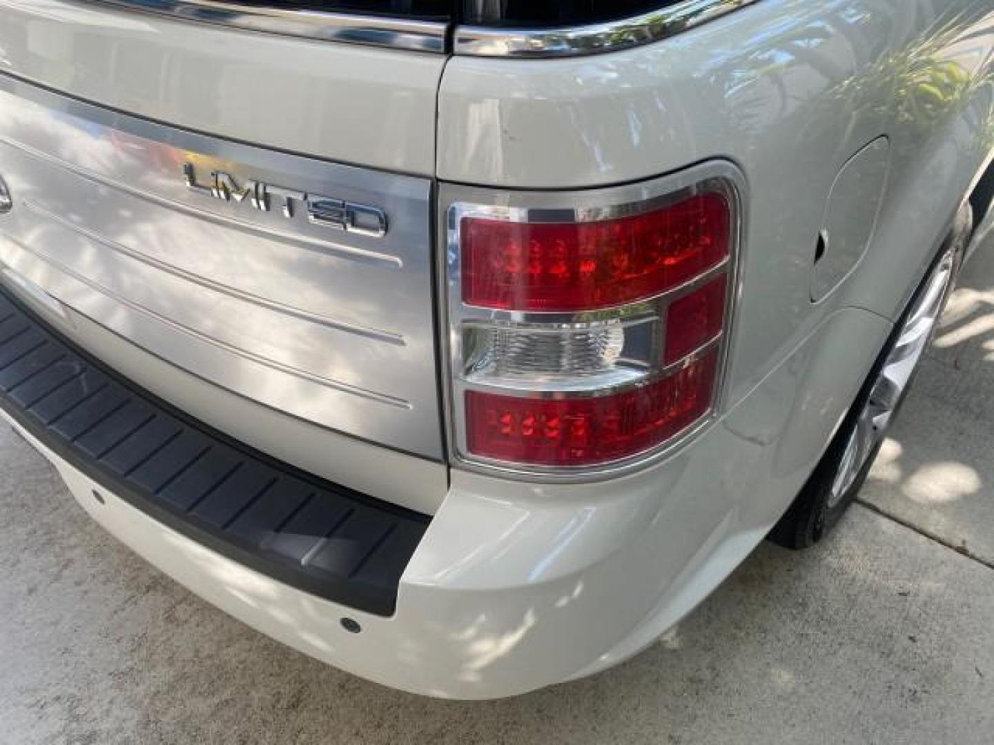 2009 White Suede /Medium Light Stone Ford Flex Limited LEATHER SUNROOF (2FMDK53C99B) with an 3.5L V6 Duratec Engine engine, Automatic transmission, located at 4701 North Dixie Hwy, Pompano Beach, FL, 33064, (954) 422-2889, 26.240938, -80.123474 - OUR WEBPAGE FLORIDACARS1.COM HAS OVER 100 PHOTOS AND FREE CARFAX LINK 2009 FORD FLEX VIN: 2FMDK53C99BA12573 4 DOOR LIMITED FWD 3.5L V6 DURATEC ENGINE GASOLINE FRONT WHEEL DRIVE Highlighted Features Bed Liner Cloth Seats ABS Brakes Automatic Transmission Power Locks AM/FM Stereo CD Audio Power Mirror - Photo#80