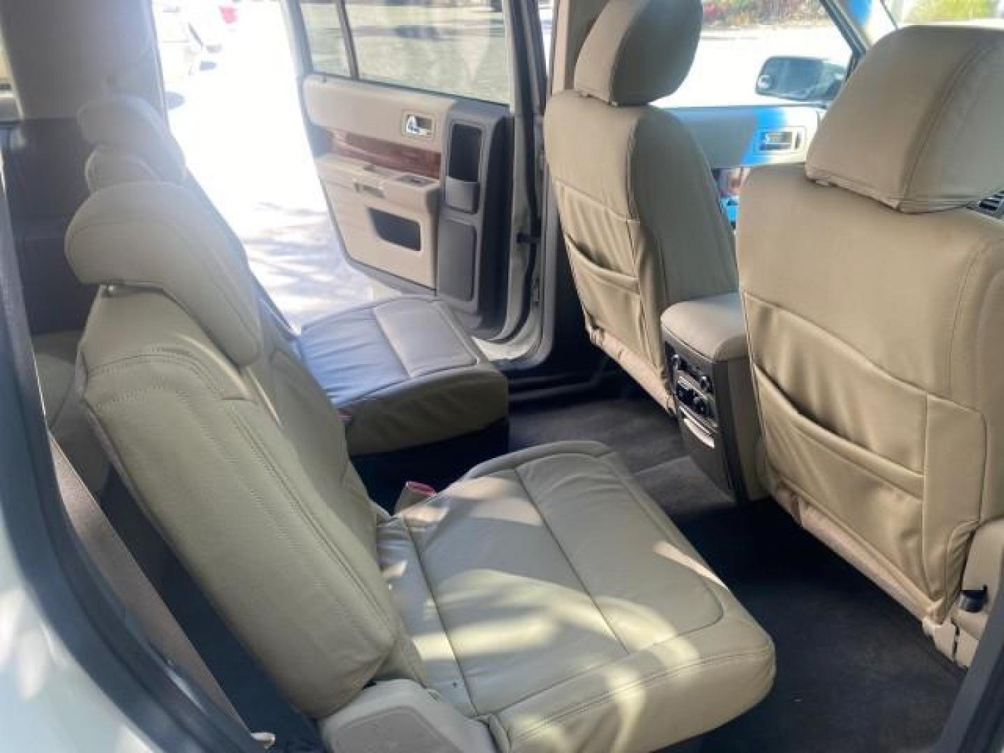 2009 White Suede /Medium Light Stone Ford Flex Limited LEATHER SUNROOF (2FMDK53C99B) with an 3.5L V6 Duratec Engine engine, Automatic transmission, located at 4701 North Dixie Hwy, Pompano Beach, FL, 33064, (954) 422-2889, 26.240938, -80.123474 - OUR WEBPAGE FLORIDACARS1.COM HAS OVER 100 PHOTOS AND FREE CARFAX LINK 2009 FORD FLEX VIN: 2FMDK53C99BA12573 4 DOOR LIMITED FWD 3.5L V6 DURATEC ENGINE GASOLINE FRONT WHEEL DRIVE Highlighted Features Bed Liner Cloth Seats ABS Brakes Automatic Transmission Power Locks AM/FM Stereo CD Audio Power Mirror - Photo#90