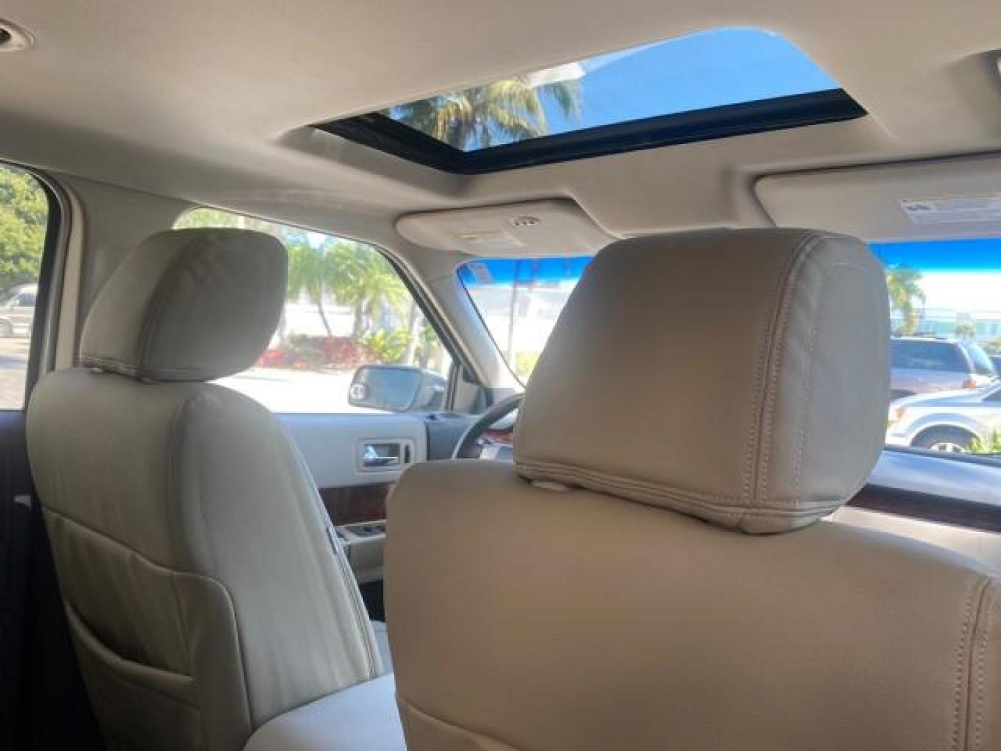2009 White Suede /Medium Light Stone Ford Flex Limited LEATHER SUNROOF (2FMDK53C99B) with an 3.5L V6 Duratec Engine engine, Automatic transmission, located at 4701 North Dixie Hwy, Pompano Beach, FL, 33064, (954) 422-2889, 26.240938, -80.123474 - OUR WEBPAGE FLORIDACARS1.COM HAS OVER 100 PHOTOS AND FREE CARFAX LINK 2009 FORD FLEX VIN: 2FMDK53C99BA12573 4 DOOR LIMITED FWD 3.5L V6 DURATEC ENGINE GASOLINE FRONT WHEEL DRIVE Highlighted Features Bed Liner Cloth Seats ABS Brakes Automatic Transmission Power Locks AM/FM Stereo CD Audio Power Mirror - Photo#93