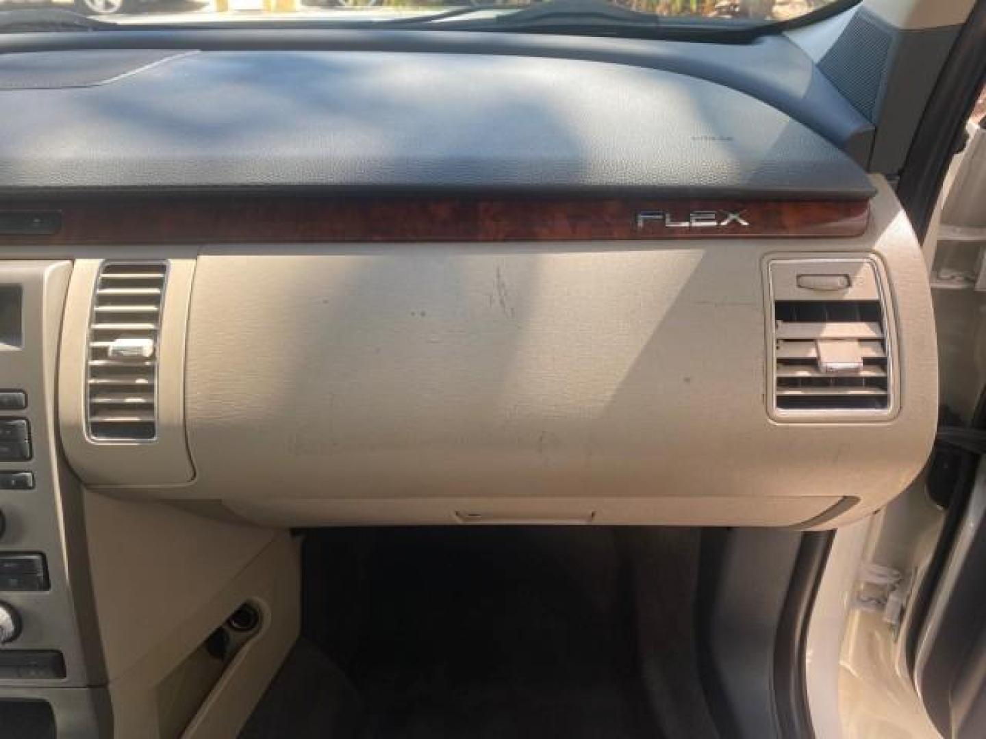 2009 White Suede /Medium Light Stone Ford Flex Limited LEATHER SUNROOF (2FMDK53C99B) with an 3.5L V6 Duratec Engine engine, Automatic transmission, located at 4701 North Dixie Hwy, Pompano Beach, FL, 33064, (954) 422-2889, 26.240938, -80.123474 - OUR WEBPAGE FLORIDACARS1.COM HAS OVER 100 PHOTOS AND FREE CARFAX LINK 2009 FORD FLEX VIN: 2FMDK53C99BA12573 4 DOOR LIMITED FWD 3.5L V6 DURATEC ENGINE GASOLINE FRONT WHEEL DRIVE Highlighted Features Bed Liner Cloth Seats ABS Brakes Automatic Transmission Power Locks AM/FM Stereo CD Audio Power Mirror - Photo#98