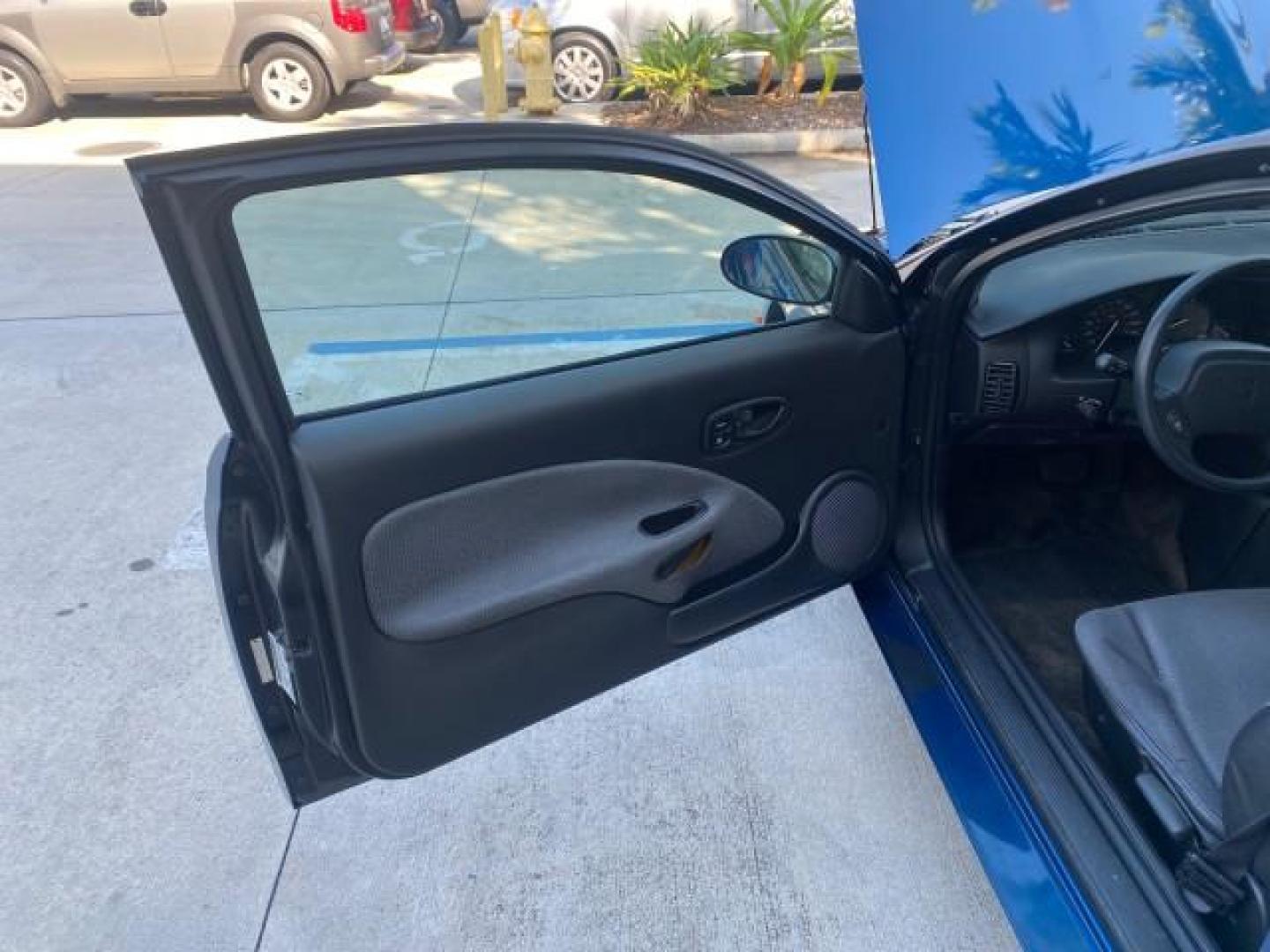 2001 Dark Blue /Grey Saturn SC 3dr COUPE LOW MILES 56,486 (1G8ZP128X1Z) with an 1.9L SOHC SPFI 8-Valve L4 Aluminum Engine engine, Automatic transmission, located at 4701 North Dixie Hwy, Pompano Beach, FL, 33064, (954) 422-2889, 26.240938, -80.123474 - OUR WEBPAGE FLORIDACARS1.COM HAS OVER 100 PHOTOS AND FREE CARFAX LINK 2001 SATURN S-SERIES SC1 VIN: 1G8ZP128X1Z255015 1 G 8 Z P 1 2 8 X 1 Z 2 5 5 0 1 5 COUPE 3 DR 1.9L I4 F SOHC GASOLINE FRONT WHEEL DRIVE Top Features Cloth Seats Leatherette and Cloth Basic Features AM/FM Stereo CD Audio Power Mir - Photo#9