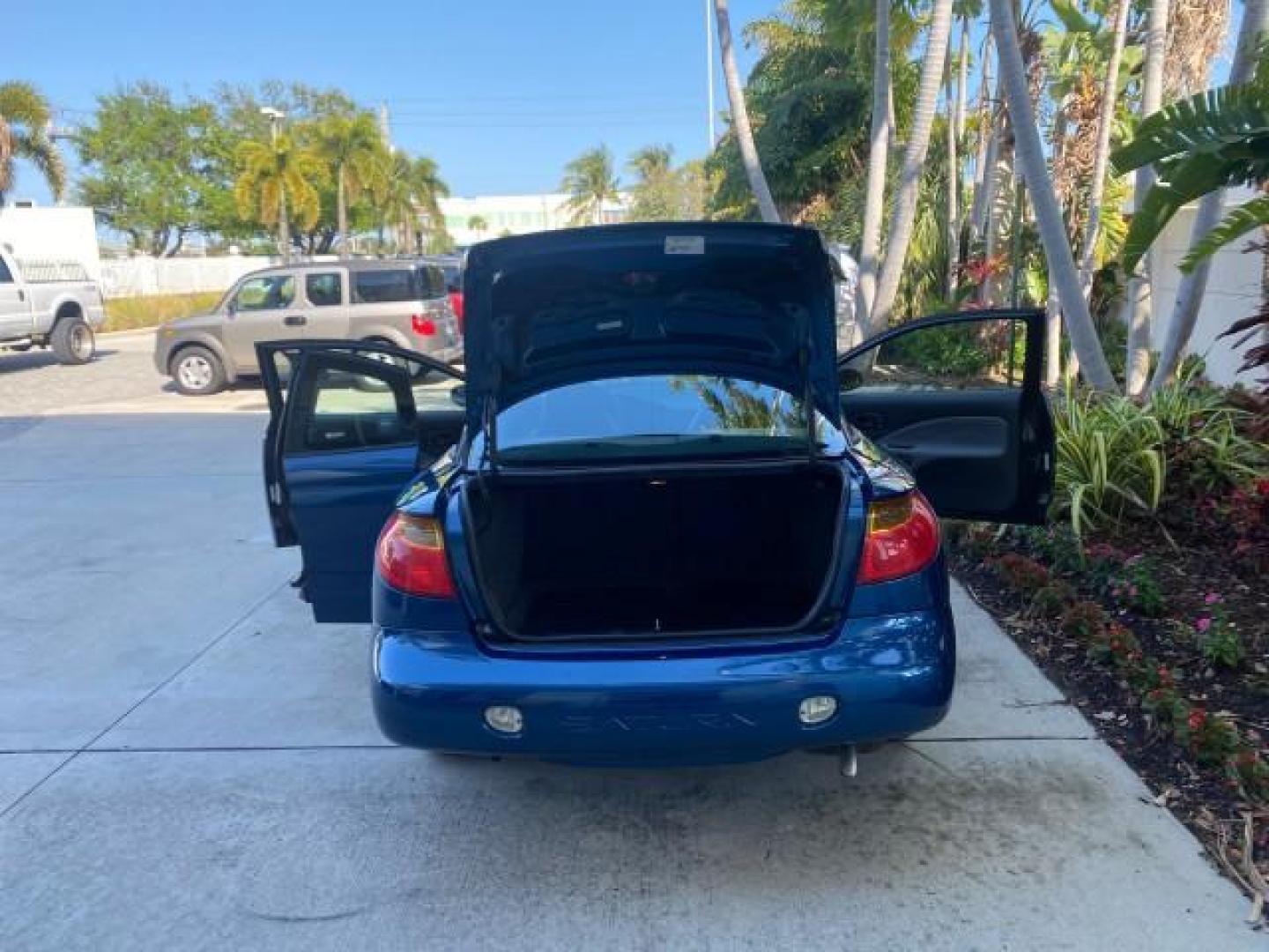 2001 Dark Blue /Grey Saturn SC 3dr COUPE LOW MILES 56,486 (1G8ZP128X1Z) with an 1.9L SOHC SPFI 8-Valve L4 Aluminum Engine engine, Automatic transmission, located at 4701 North Dixie Hwy, Pompano Beach, FL, 33064, (954) 422-2889, 26.240938, -80.123474 - OUR WEBPAGE FLORIDACARS1.COM HAS OVER 100 PHOTOS AND FREE CARFAX LINK 2001 SATURN S-SERIES SC1 VIN: 1G8ZP128X1Z255015 1 G 8 Z P 1 2 8 X 1 Z 2 5 5 0 1 5 COUPE 3 DR 1.9L I4 F SOHC GASOLINE FRONT WHEEL DRIVE Top Features Cloth Seats Leatherette and Cloth Basic Features AM/FM Stereo CD Audio Power Mir - Photo#15