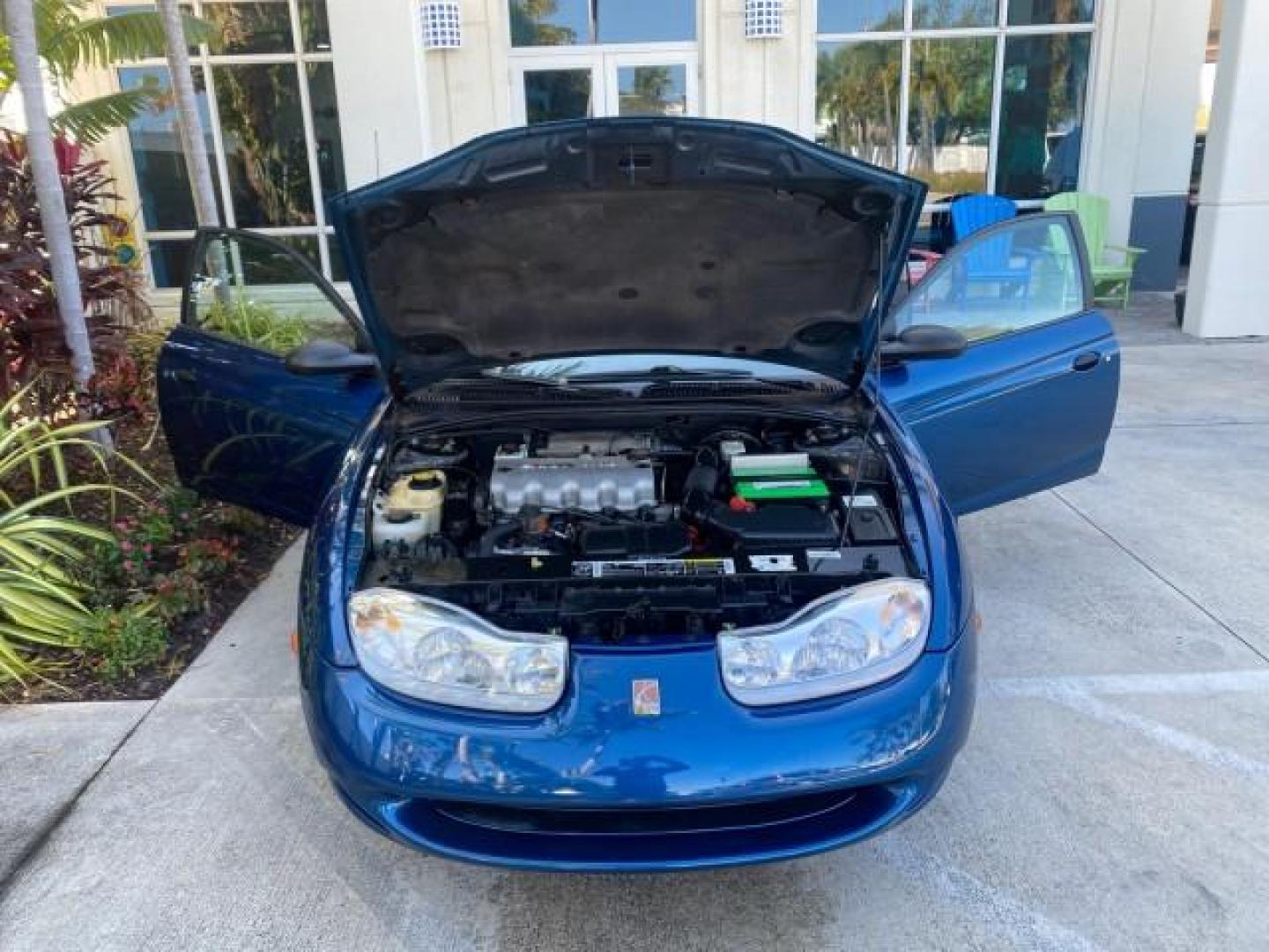 2001 Dark Blue /Grey Saturn SC 3dr COUPE LOW MILES 56,486 (1G8ZP128X1Z) with an 1.9L SOHC SPFI 8-Valve L4 Aluminum Engine engine, Automatic transmission, located at 4701 North Dixie Hwy, Pompano Beach, FL, 33064, (954) 422-2889, 26.240938, -80.123474 - OUR WEBPAGE FLORIDACARS1.COM HAS OVER 100 PHOTOS AND FREE CARFAX LINK 2001 SATURN S-SERIES SC1 VIN: 1G8ZP128X1Z255015 1 G 8 Z P 1 2 8 X 1 Z 2 5 5 0 1 5 COUPE 3 DR 1.9L I4 F SOHC GASOLINE FRONT WHEEL DRIVE Top Features Cloth Seats Leatherette and Cloth Basic Features AM/FM Stereo CD Audio Power Mir - Photo#16