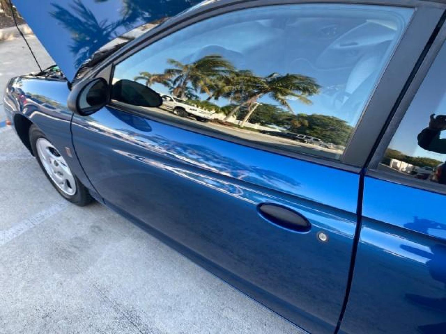 2001 Dark Blue /Grey Saturn SC 3dr COUPE LOW MILES 56,486 (1G8ZP128X1Z) with an 1.9L SOHC SPFI 8-Valve L4 Aluminum Engine engine, Automatic transmission, located at 4701 North Dixie Hwy, Pompano Beach, FL, 33064, (954) 422-2889, 26.240938, -80.123474 - OUR WEBPAGE FLORIDACARS1.COM HAS OVER 100 PHOTOS AND FREE CARFAX LINK 2001 SATURN S-SERIES SC1 VIN: 1G8ZP128X1Z255015 1 G 8 Z P 1 2 8 X 1 Z 2 5 5 0 1 5 COUPE 3 DR 1.9L I4 F SOHC GASOLINE FRONT WHEEL DRIVE Top Features Cloth Seats Leatherette and Cloth Basic Features AM/FM Stereo CD Audio Power Mir - Photo#27