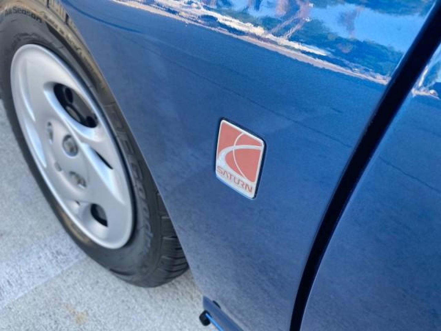2001 Dark Blue /Grey Saturn SC 3dr COUPE LOW MILES 56,486 (1G8ZP128X1Z) with an 1.9L SOHC SPFI 8-Valve L4 Aluminum Engine engine, Automatic transmission, located at 4701 North Dixie Hwy, Pompano Beach, FL, 33064, (954) 422-2889, 26.240938, -80.123474 - OUR WEBPAGE FLORIDACARS1.COM HAS OVER 100 PHOTOS AND FREE CARFAX LINK 2001 SATURN S-SERIES SC1 VIN: 1G8ZP128X1Z255015 1 G 8 Z P 1 2 8 X 1 Z 2 5 5 0 1 5 COUPE 3 DR 1.9L I4 F SOHC GASOLINE FRONT WHEEL DRIVE Top Features Cloth Seats Leatherette and Cloth Basic Features AM/FM Stereo CD Audio Power Mir - Photo#31