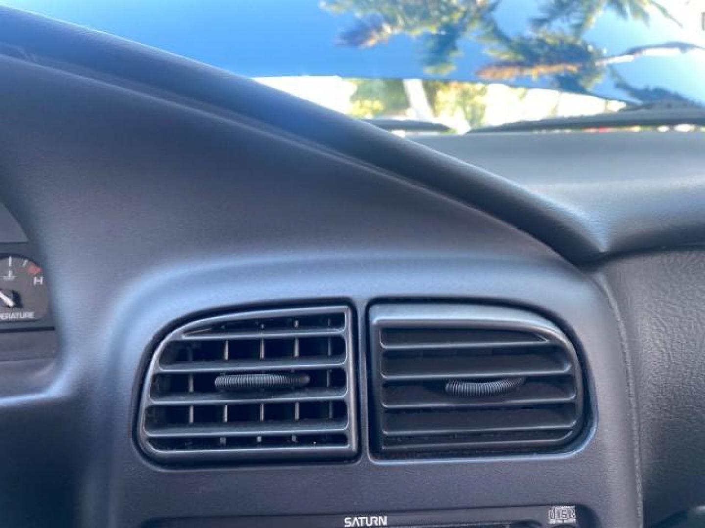2001 Dark Blue /Grey Saturn SC 3dr COUPE LOW MILES 56,486 (1G8ZP128X1Z) with an 1.9L SOHC SPFI 8-Valve L4 Aluminum Engine engine, Automatic transmission, located at 4701 North Dixie Hwy, Pompano Beach, FL, 33064, (954) 422-2889, 26.240938, -80.123474 - OUR WEBPAGE FLORIDACARS1.COM HAS OVER 100 PHOTOS AND FREE CARFAX LINK 2001 SATURN S-SERIES SC1 VIN: 1G8ZP128X1Z255015 1 G 8 Z P 1 2 8 X 1 Z 2 5 5 0 1 5 COUPE 3 DR 1.9L I4 F SOHC GASOLINE FRONT WHEEL DRIVE Top Features Cloth Seats Leatherette and Cloth Basic Features AM/FM Stereo CD Audio Power Mir - Photo#40