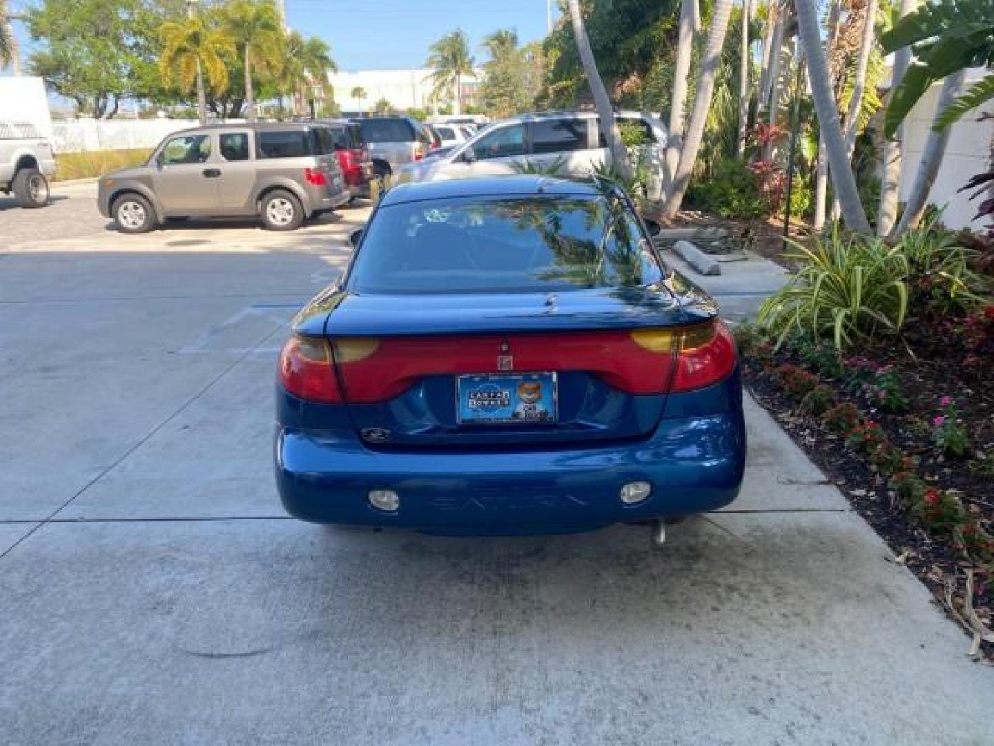 2001 Dark Blue /Grey Saturn SC 3dr COUPE LOW MILES 56,486 (1G8ZP128X1Z) with an 1.9L SOHC SPFI 8-Valve L4 Aluminum Engine engine, Automatic transmission, located at 4701 North Dixie Hwy, Pompano Beach, FL, 33064, (954) 422-2889, 26.240938, -80.123474 - OUR WEBPAGE FLORIDACARS1.COM HAS OVER 100 PHOTOS AND FREE CARFAX LINK 2001 SATURN S-SERIES SC1 VIN: 1G8ZP128X1Z255015 1 G 8 Z P 1 2 8 X 1 Z 2 5 5 0 1 5 COUPE 3 DR 1.9L I4 F SOHC GASOLINE FRONT WHEEL DRIVE Top Features Cloth Seats Leatherette and Cloth Basic Features AM/FM Stereo CD Audio Power Mir - Photo#6