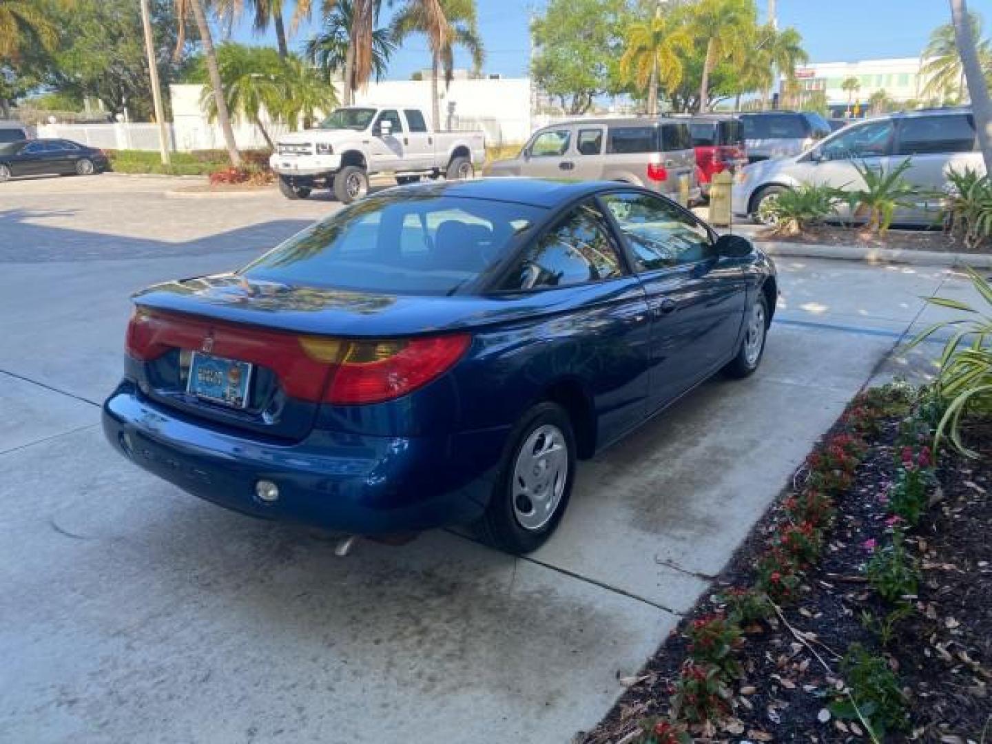 2001 Dark Blue /Grey Saturn SC 3dr COUPE LOW MILES 56,486 (1G8ZP128X1Z) with an 1.9L SOHC SPFI 8-Valve L4 Aluminum Engine engine, Automatic transmission, located at 4701 North Dixie Hwy, Pompano Beach, FL, 33064, (954) 422-2889, 26.240938, -80.123474 - OUR WEBPAGE FLORIDACARS1.COM HAS OVER 100 PHOTOS AND FREE CARFAX LINK 2001 SATURN S-SERIES SC1 VIN: 1G8ZP128X1Z255015 1 G 8 Z P 1 2 8 X 1 Z 2 5 5 0 1 5 COUPE 3 DR 1.9L I4 F SOHC GASOLINE FRONT WHEEL DRIVE Top Features Cloth Seats Leatherette and Cloth Basic Features AM/FM Stereo CD Audio Power Mir - Photo#7