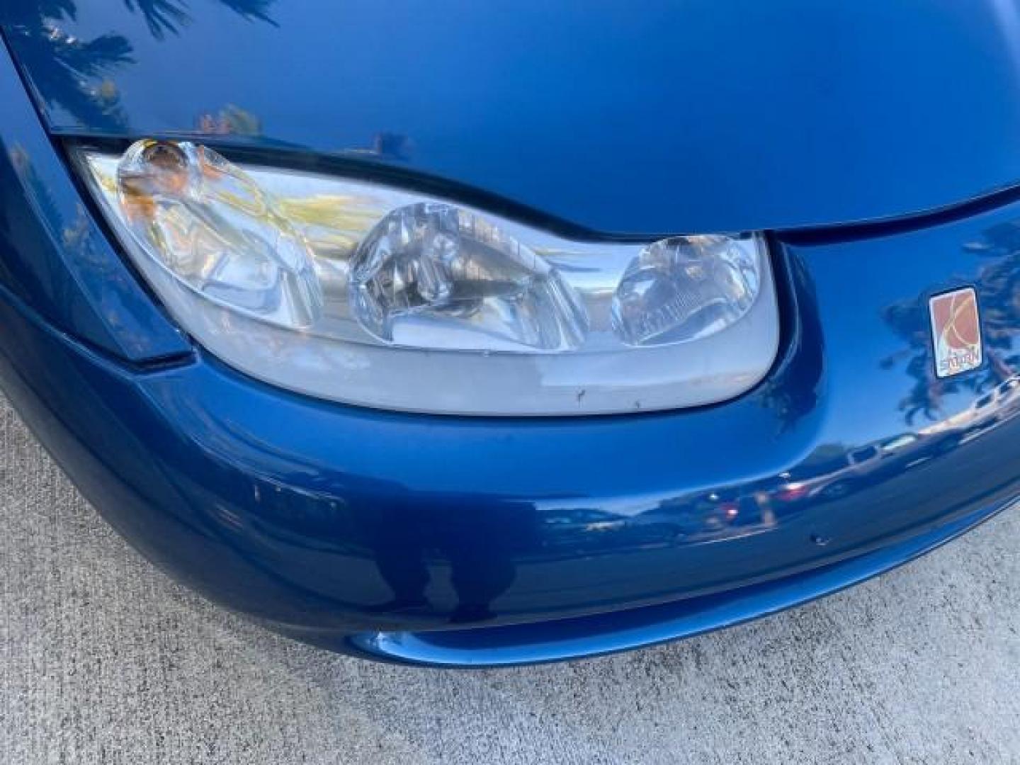 2001 Dark Blue /Grey Saturn SC 3dr COUPE LOW MILES 56,486 (1G8ZP128X1Z) with an 1.9L SOHC SPFI 8-Valve L4 Aluminum Engine engine, Automatic transmission, located at 4701 North Dixie Hwy, Pompano Beach, FL, 33064, (954) 422-2889, 26.240938, -80.123474 - OUR WEBPAGE FLORIDACARS1.COM HAS OVER 100 PHOTOS AND FREE CARFAX LINK 2001 SATURN S-SERIES SC1 VIN: 1G8ZP128X1Z255015 1 G 8 Z P 1 2 8 X 1 Z 2 5 5 0 1 5 COUPE 3 DR 1.9L I4 F SOHC GASOLINE FRONT WHEEL DRIVE Top Features Cloth Seats Leatherette and Cloth Basic Features AM/FM Stereo CD Audio Power Mir - Photo#81