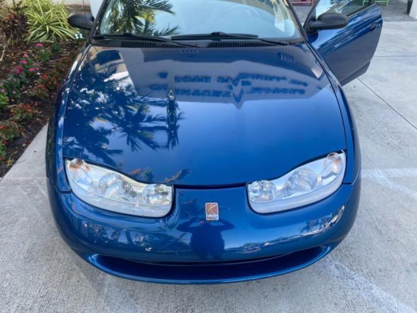 2001 Dark Blue /Grey Saturn SC 3dr COUPE LOW MILES 56,486 (1G8ZP128X1Z) with an 1.9L SOHC SPFI 8-Valve L4 Aluminum Engine engine, Automatic transmission, located at 4701 North Dixie Hwy, Pompano Beach, FL, 33064, (954) 422-2889, 26.240938, -80.123474 - OUR WEBPAGE FLORIDACARS1.COM HAS OVER 100 PHOTOS AND FREE CARFAX LINK 2001 SATURN S-SERIES SC1 VIN: 1G8ZP128X1Z255015 1 G 8 Z P 1 2 8 X 1 Z 2 5 5 0 1 5 COUPE 3 DR 1.9L I4 F SOHC GASOLINE FRONT WHEEL DRIVE Top Features Cloth Seats Leatherette and Cloth Basic Features AM/FM Stereo CD Audio Power Mir - Photo#82
