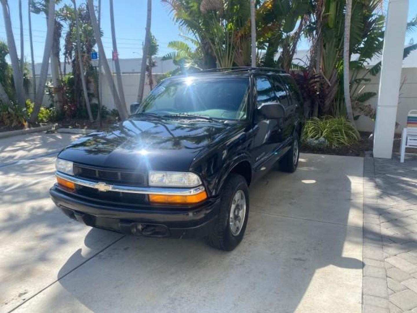 2002 Onyx Black /Medium Gray Chevrolet Blazer LS 4WD LOW MILES 35,402 (1GNDT13W62K) with an 4.3L Vortec 1000 SFI V6 Engine engine, Automatic transmission, located at 4701 North Dixie Hwy, Pompano Beach, FL, 33064, (954) 422-2889, 26.240938, -80.123474 - OUR WEBPAGE FLORIDACARS1.COM HAS OVER 100 PHOTOS AND FREE CARFAX LINK 2002 CHEVROLET BLAZER LS VIN: 1GNDT13W62K130832 1 G N D T 1 3 W 6 2 K 1 3 0 8 3 2 4 DOOR WAGON/SPORT UTILITY 4.3L V6 F OHV 12V GASOLINE REAR WHEEL DRIVE W/ 4X4 Top Features 4WD/AWD Cloth Seats Alloy Wheels Tow Hitch Basic Features - Photo#3