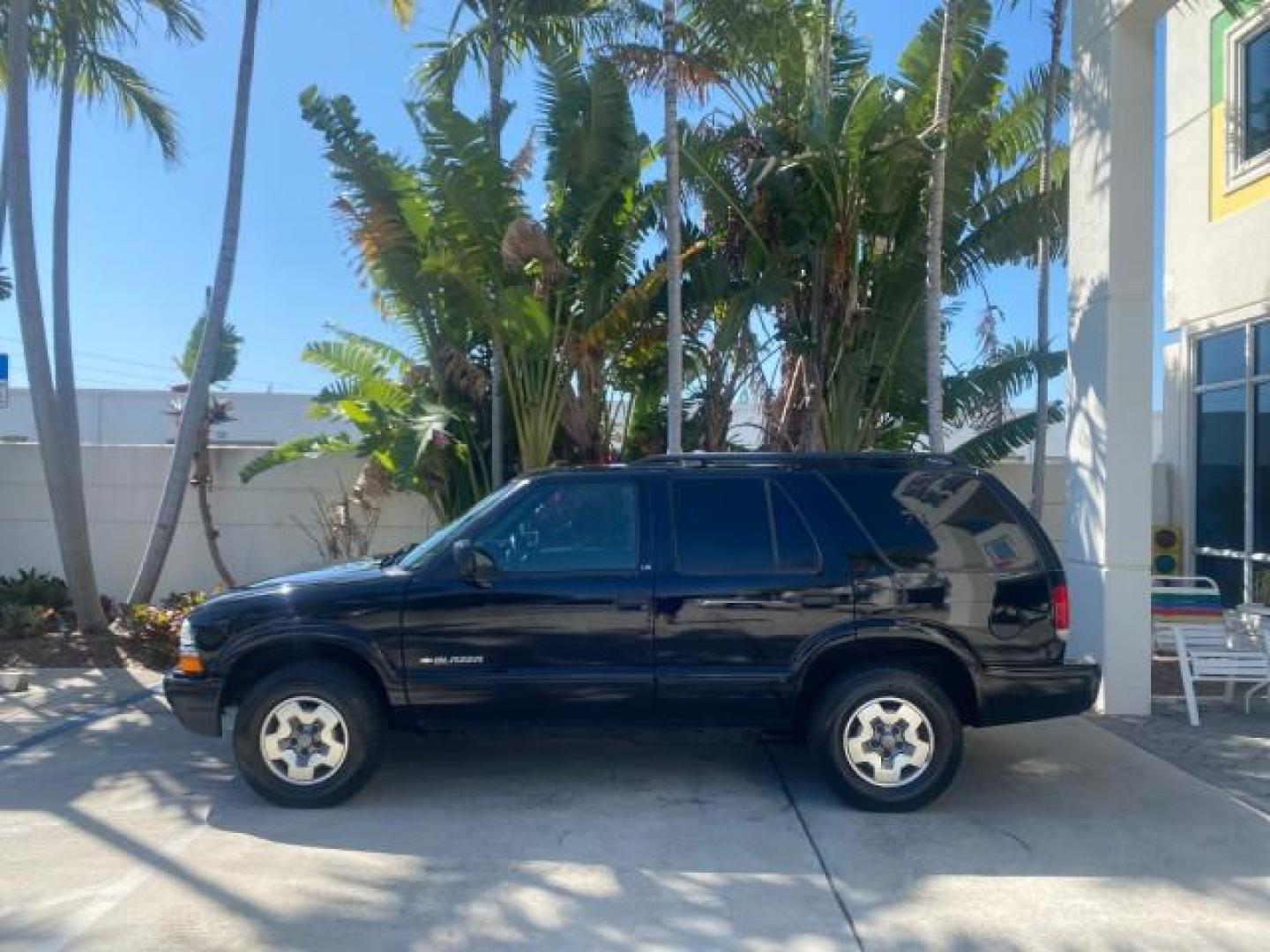 2002 Onyx Black /Medium Gray Chevrolet Blazer LS 4WD LOW MILES 35,402 (1GNDT13W62K) with an 4.3L Vortec 1000 SFI V6 Engine engine, Automatic transmission, located at 4701 North Dixie Hwy, Pompano Beach, FL, 33064, (954) 422-2889, 26.240938, -80.123474 - OUR WEBPAGE FLORIDACARS1.COM HAS OVER 100 PHOTOS AND FREE CARFAX LINK 2002 CHEVROLET BLAZER LS VIN: 1GNDT13W62K130832 1 G N D T 1 3 W 6 2 K 1 3 0 8 3 2 4 DOOR WAGON/SPORT UTILITY 4.3L V6 F OHV 12V GASOLINE REAR WHEEL DRIVE W/ 4X4 Top Features 4WD/AWD Cloth Seats Alloy Wheels Tow Hitch Basic Features - Photo#4